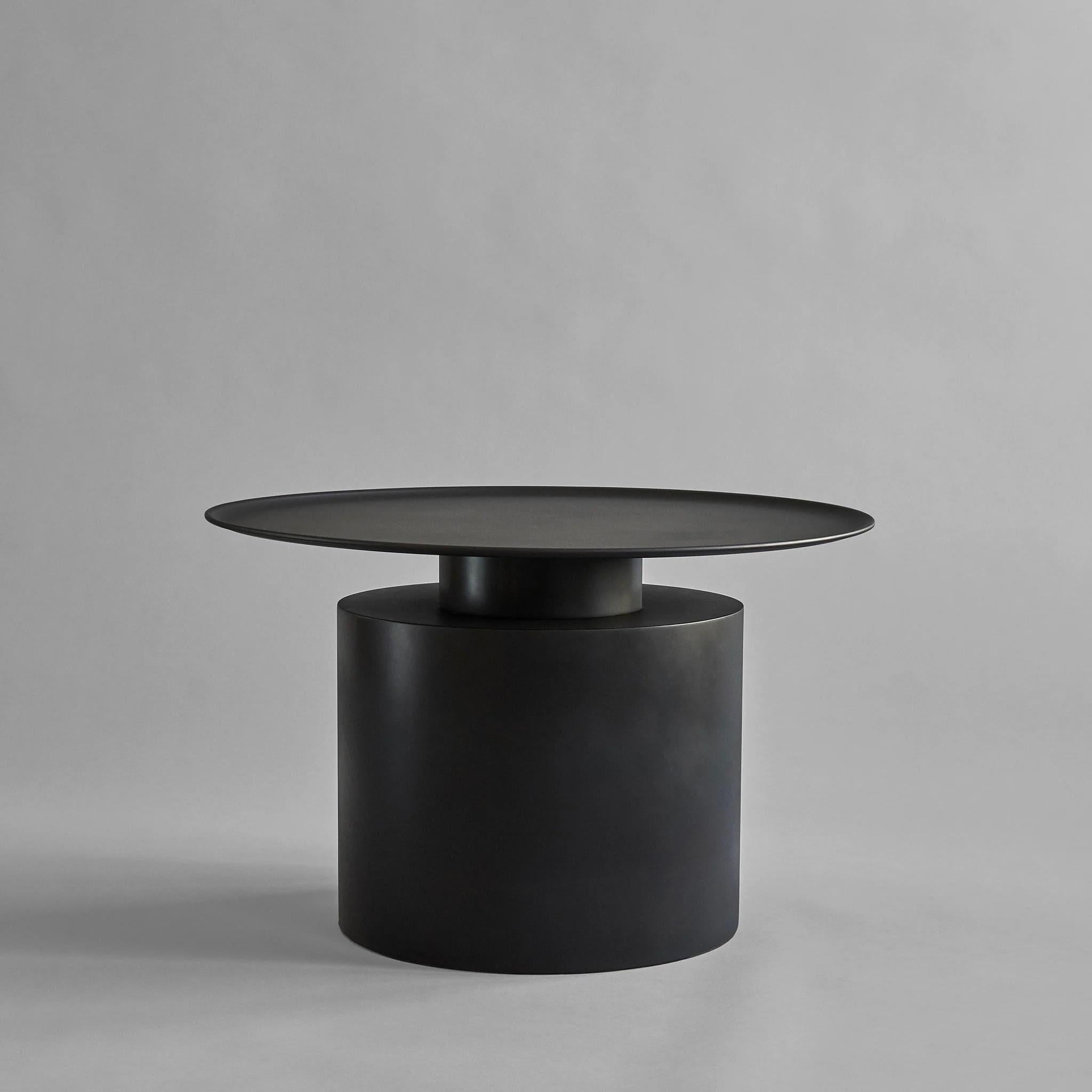 Coffee table, Pillar model, design like a modern sculpture in plated metal, contemporary work.

The Pilier coffee table is inspired by the rich and brilliant use of materials in the Art Deco movement of the 1930s. 
The Pilier coffee table is