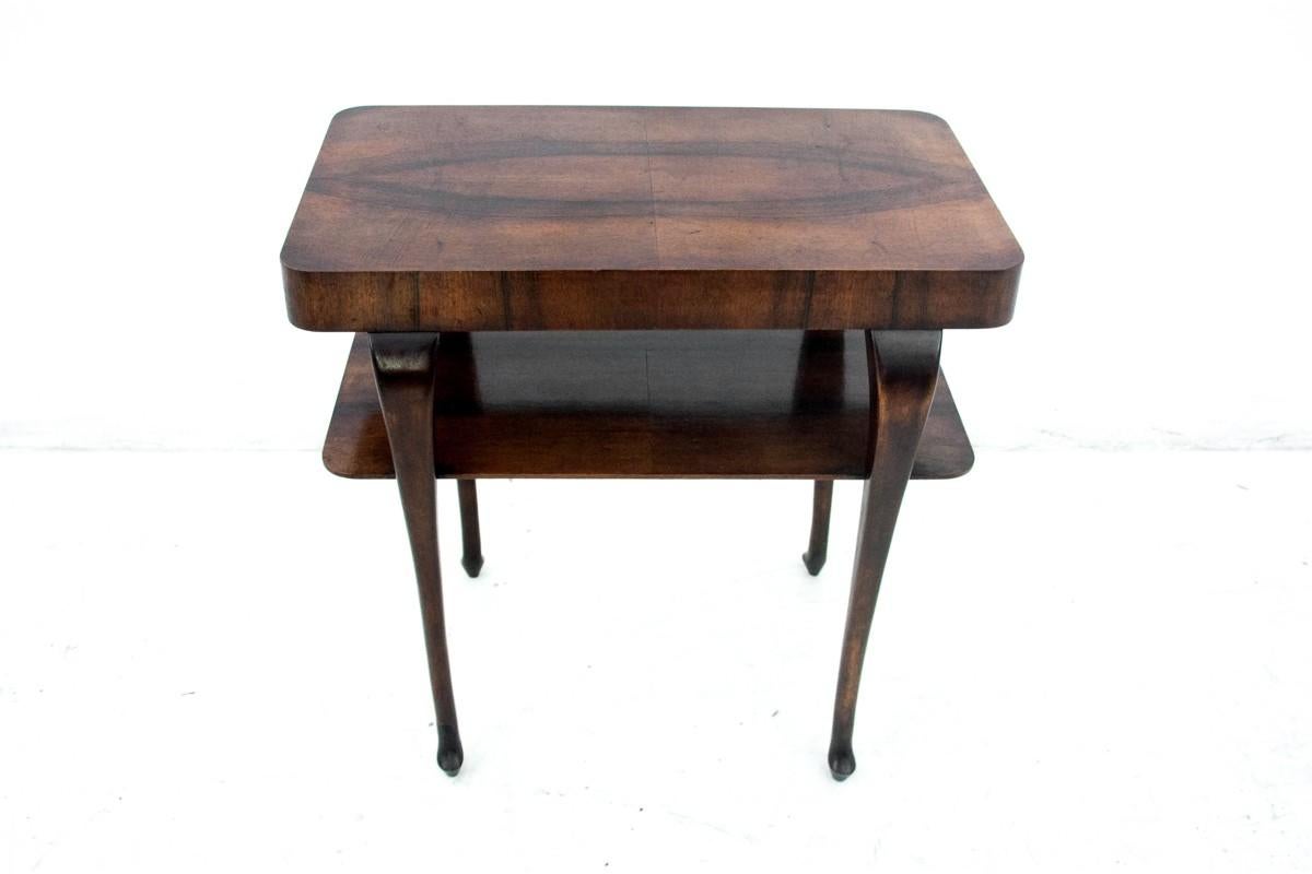 A historic table from the 1930s.

Dimensions: height 70 cm / width 70 cm / depth 45 cm.