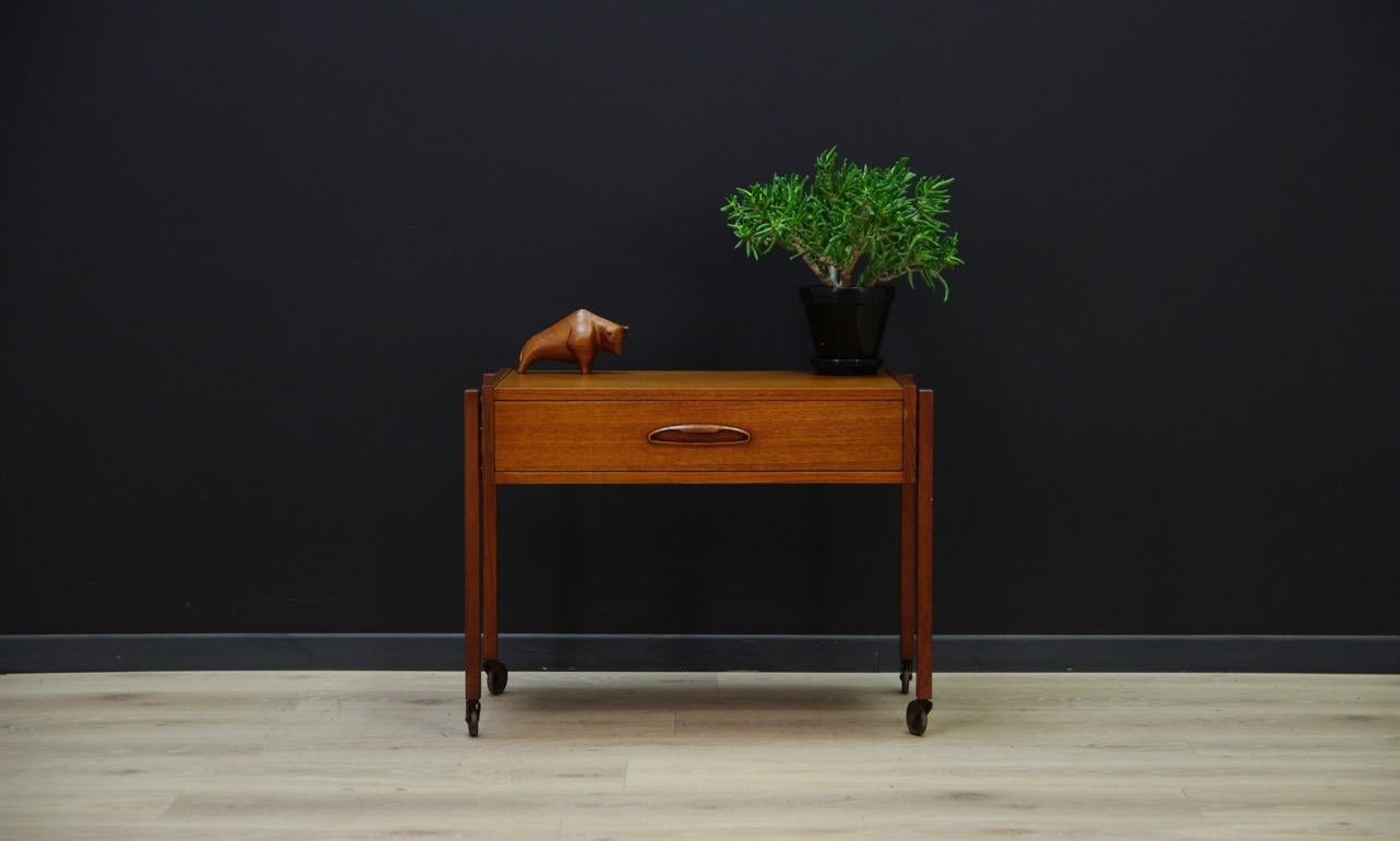 Coffee table from the 1960s-1970s, Danish precision. The structure is covered with teak veneer. The furniture has a drawer with compartments. In addition, the legs are placed on wheels. Preserved in good condition (small bruises and scratches,