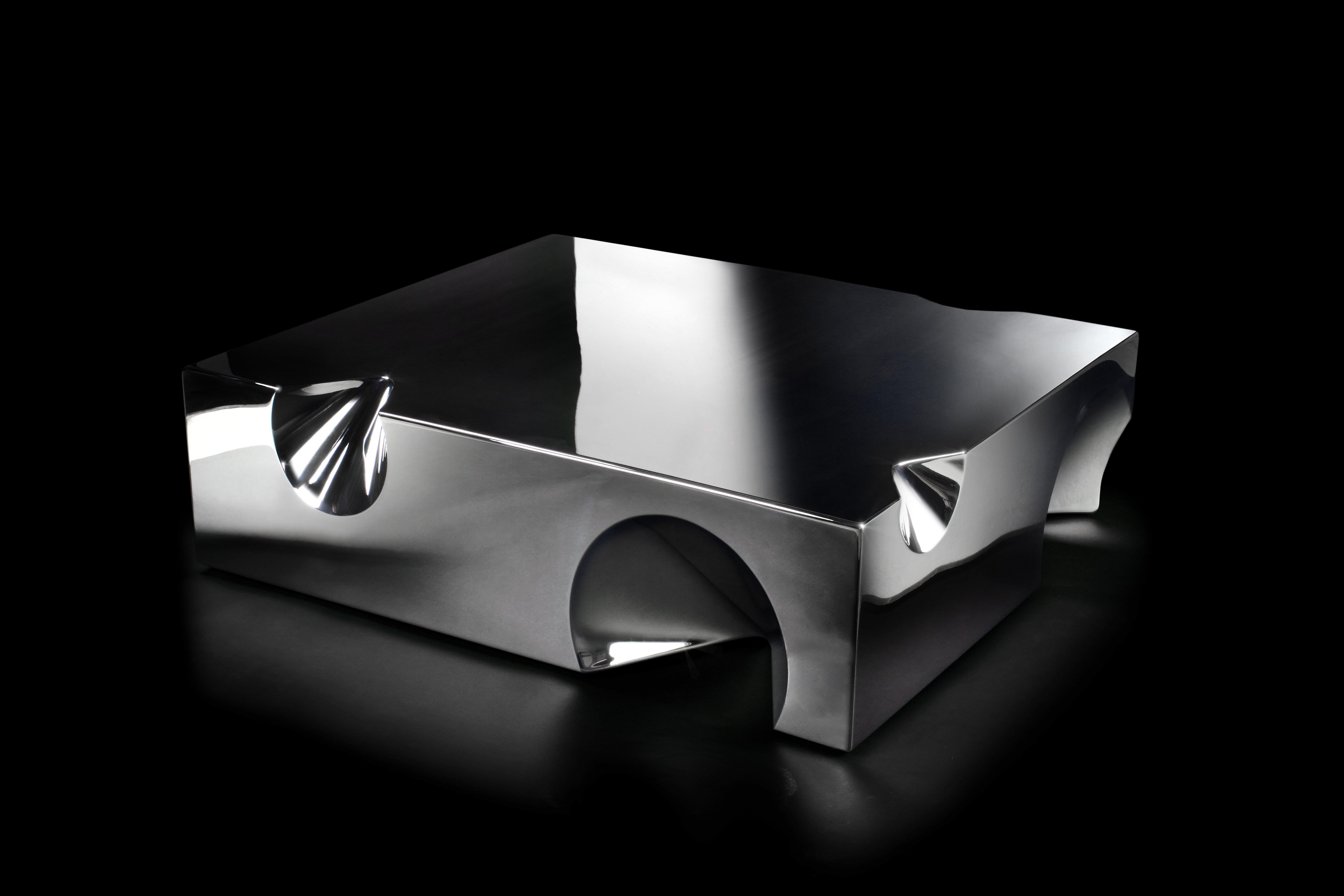 The 'Get Lost!' sculptural coffee table is made of mirror polished stainless steel. The table has a monolithic shape but inside it is hollow, the whole structure is manually welded and mirror polished. An artwork of great aesthetic impact, thanks to