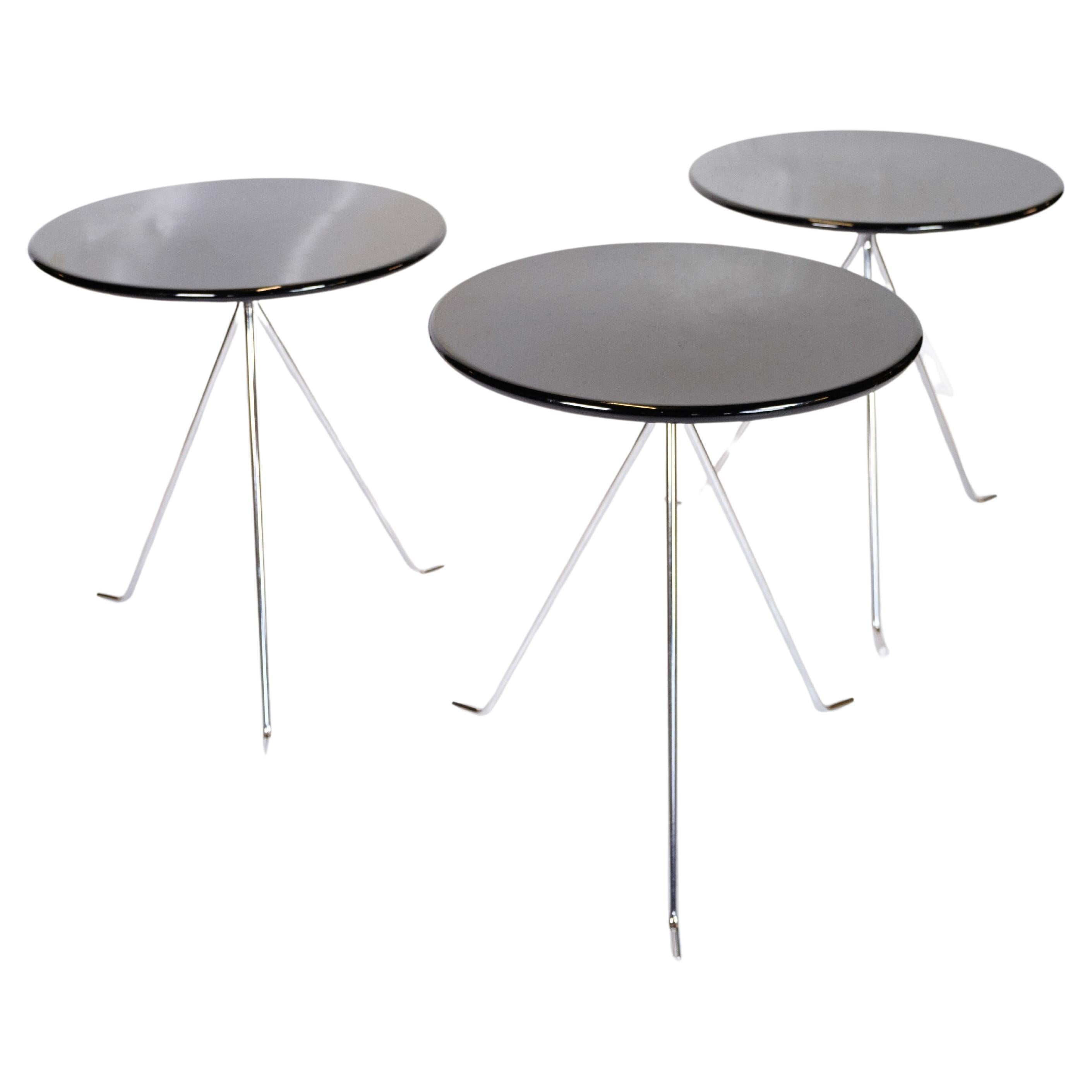 Coffee table set consisting of 3 small round tables with chrome legs  For Sale