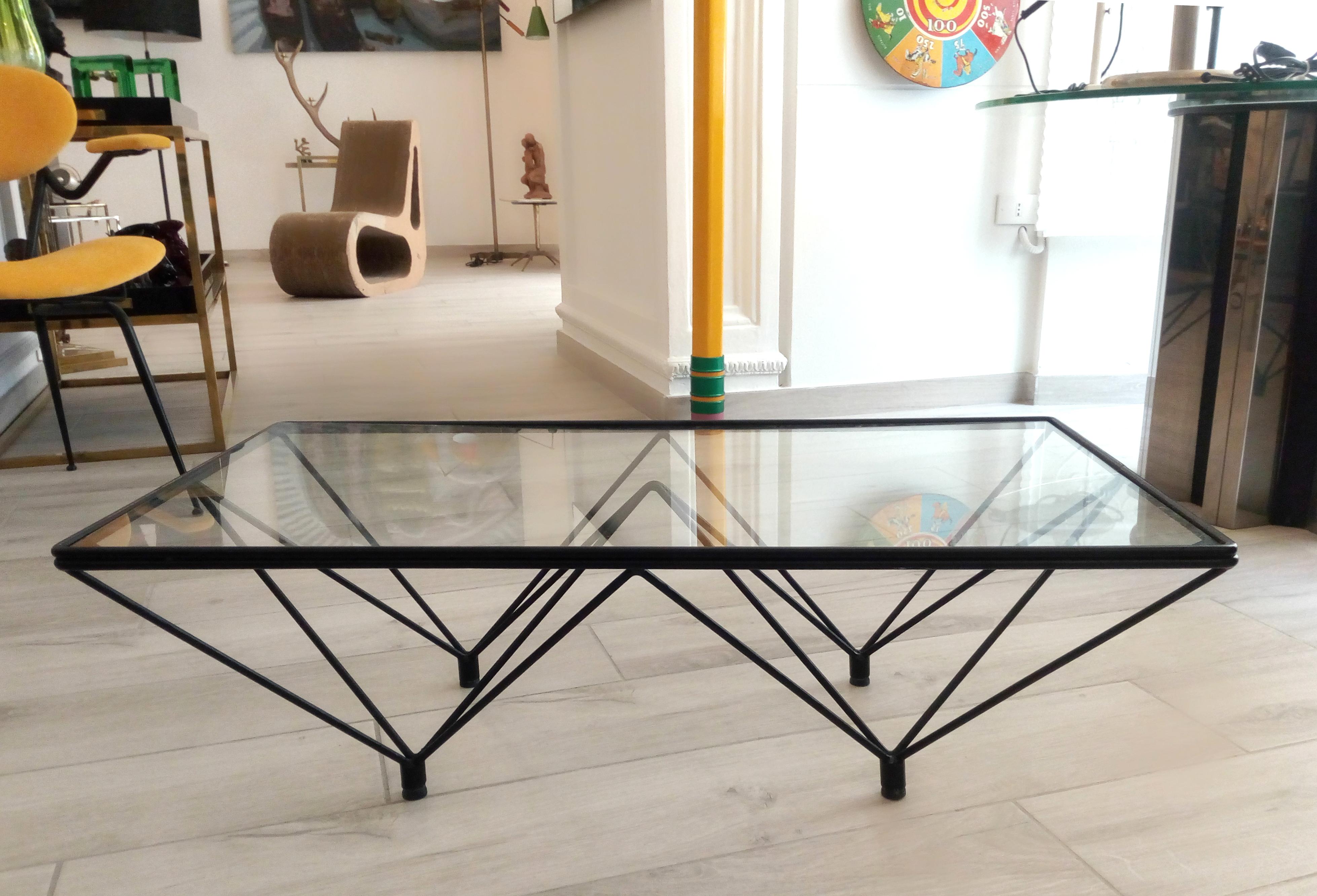 A beautiful and trendy coffee table designed in the style of Paolo Piva for B&B, Italy, circa 1980s. It could be used also as side table. Made of black enameled steel with a clear thick glass top.