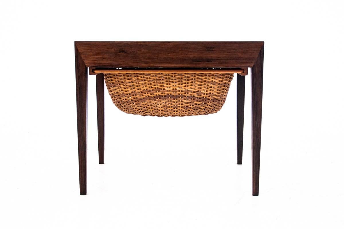 Table / niciak, Denmark, 1960s.

A small table will work perfectly even in small rooms. The table has a wicker drawer and a side-mounted storage with many compartments. The table has been renovated. The wood has been cleaned and finished with a