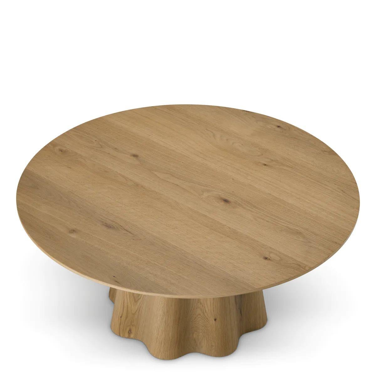 The Coffee Table is a sculptural coffee table crafted from warm oak veneer with an open, expressive grain. This elegant coffee table reflects the same refined design as the matching dining table. The table’s organic curves and balanced proportions