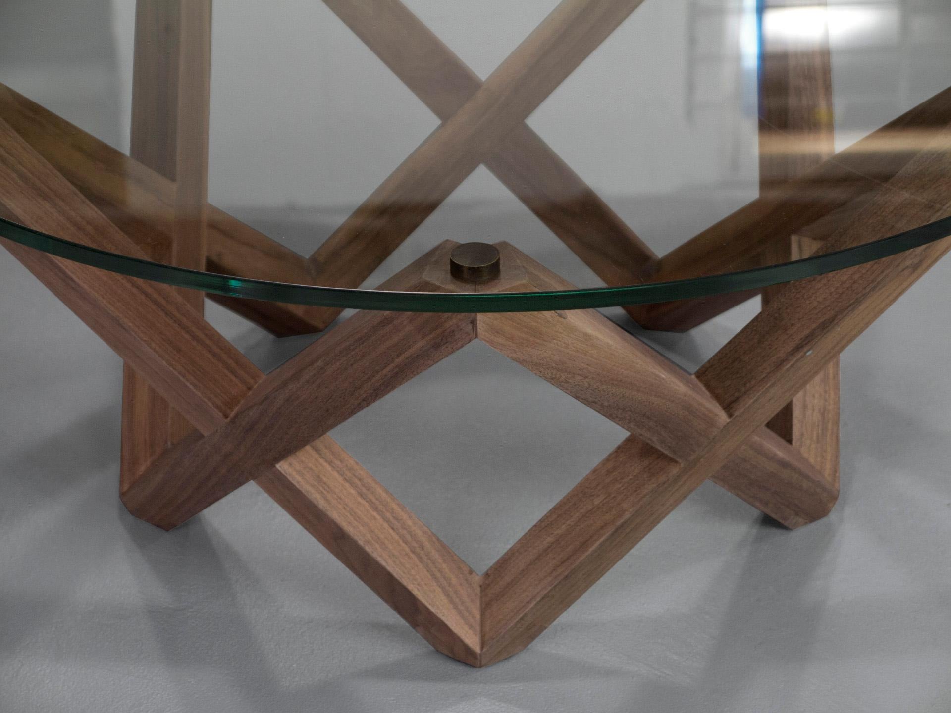 Minimalist COFFEE TABLE with a black walnut star shaped base and round glass top For Sale