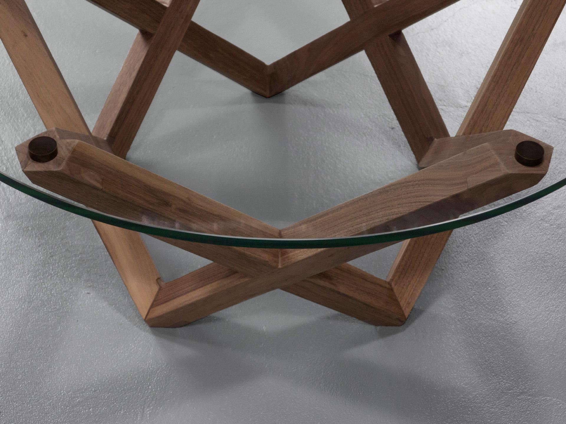 American COFFEE TABLE with a black walnut star shaped base and round glass top For Sale