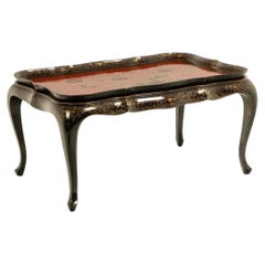 Coffee table with a removable top, made of red and black lacquered wood. 1950s.