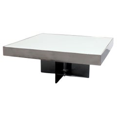 Coffee table with a smoked glass cross base and mirrored top