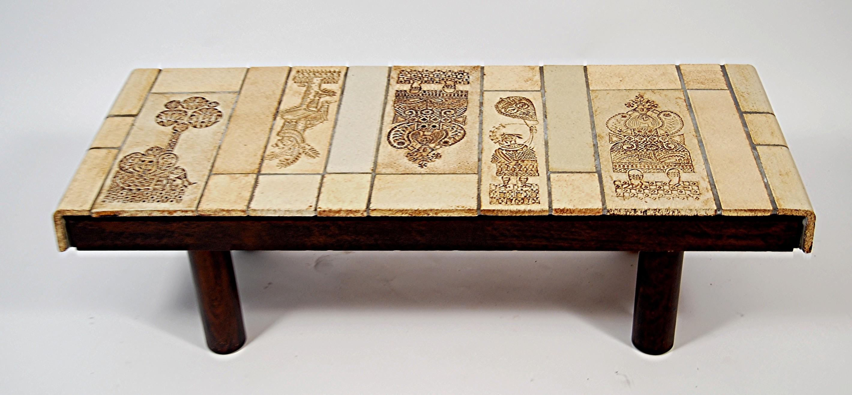 Vintage ceramic coffee table with roger capron tiles.   Hand-crafted tiles produced by a technique in which real leaves were pressed into the clay and, during firing, disintegrated, leaving a finely detailed imprint.

Table of the dancers of Roger