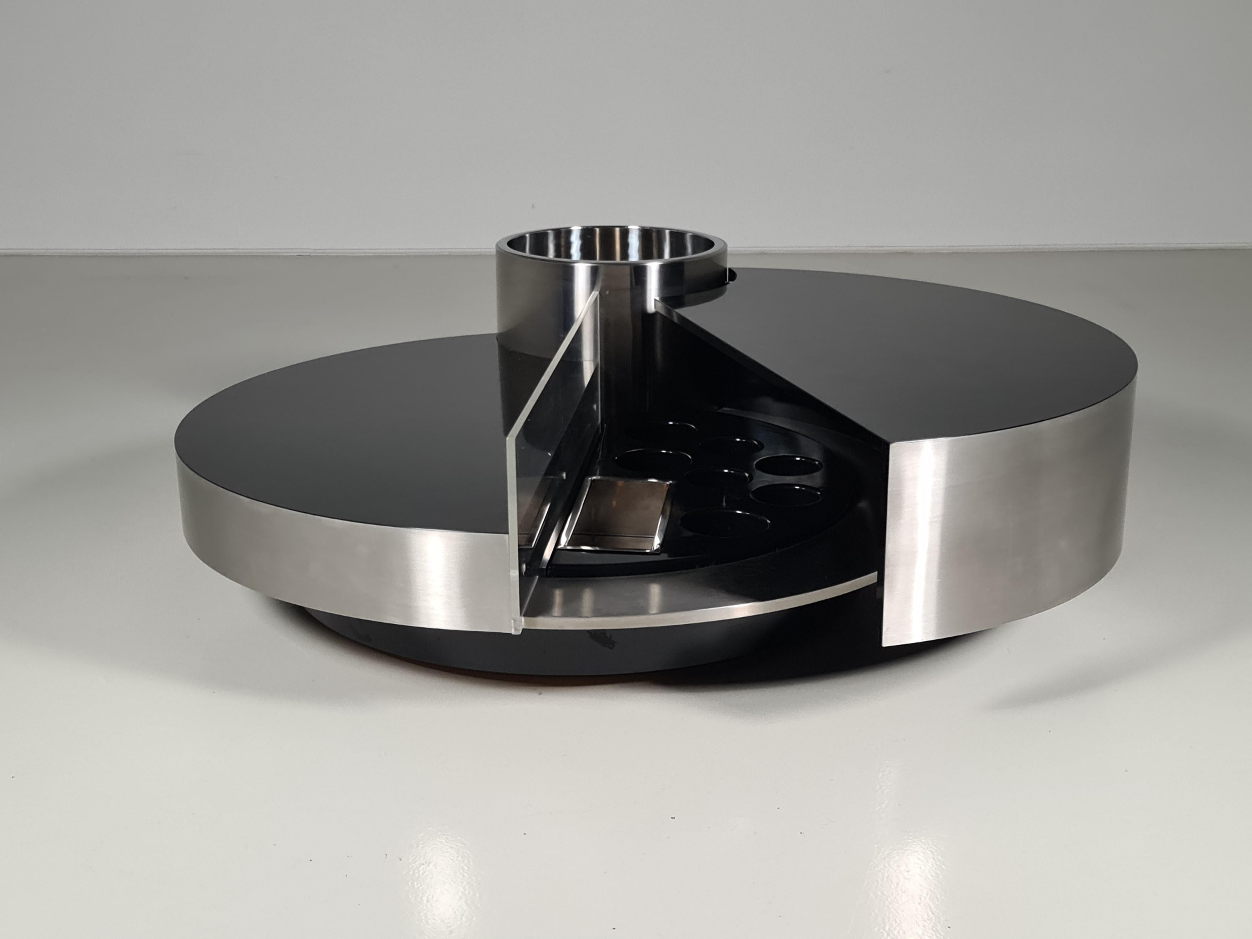 Massimo Papiri for Mario Sabot, coffee table and dry bar, chrome, plexiglass, wood, Italy, 1970s.

This iconic cocktail table is designed by Massimo Papiri. This piece is exemplary for the architectural glamour style that Papiri is known for. The