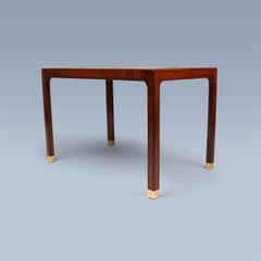 Coffee table with black/white inlaid tiles, turquoise details and brass feet.