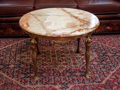 Coffee table with mermaids and onyx top