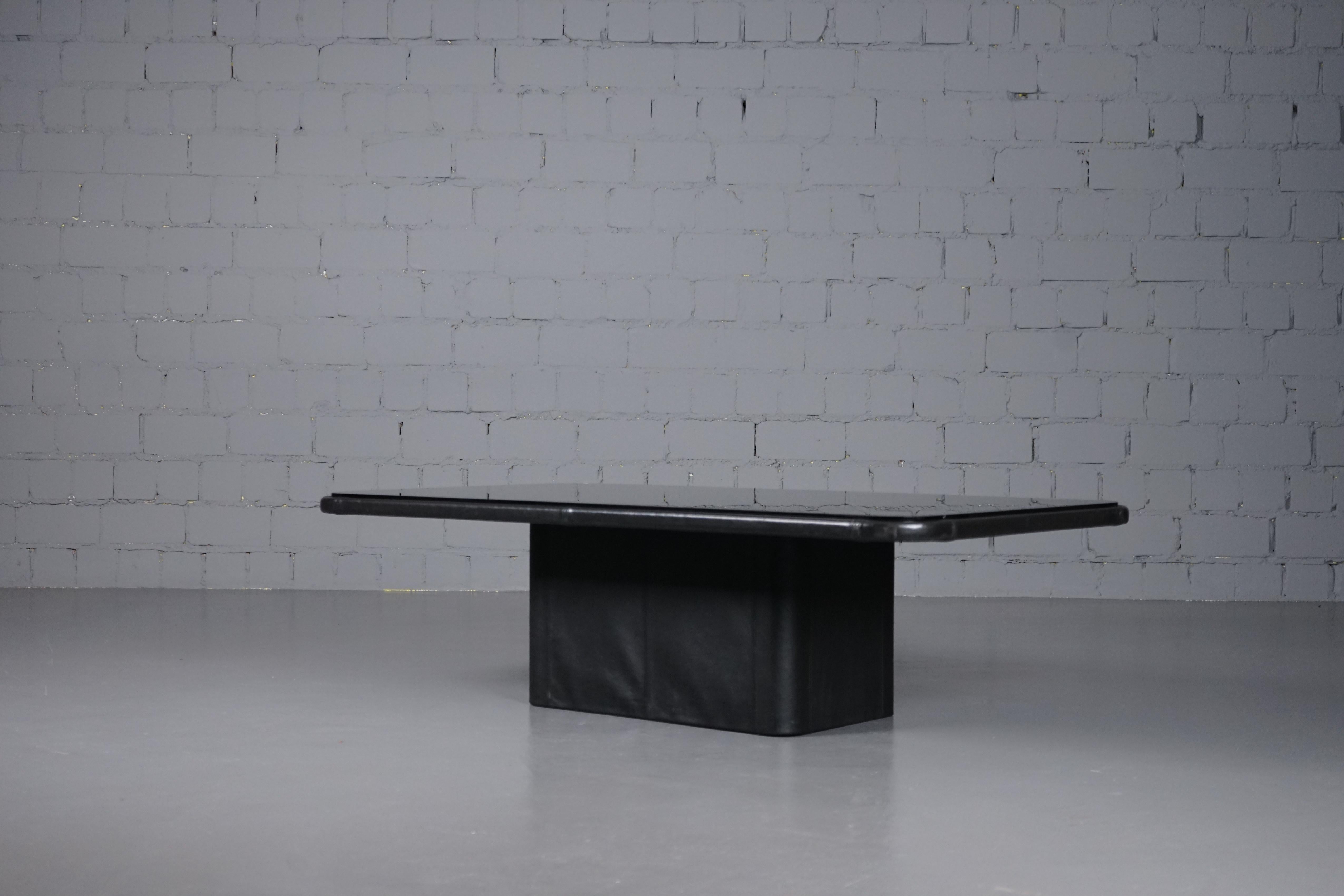 A classic coffee table with mirror glass & black leather from De Sede designed in the 1970s.