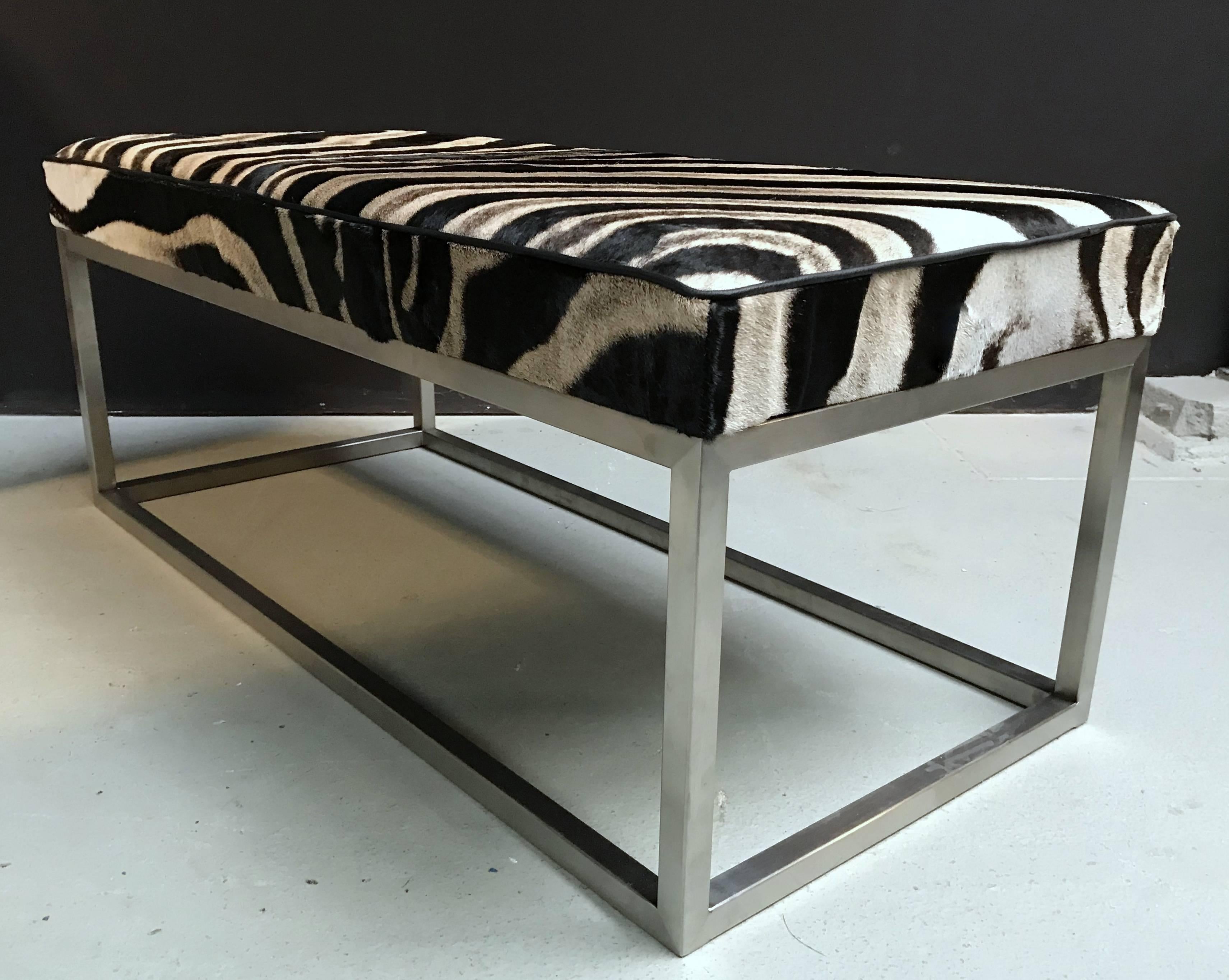 Elegant coffee table, top Burchell zebra skin with a black leather piping on the edges.
Stainless steel frame. These can also be made in other sizes.

 