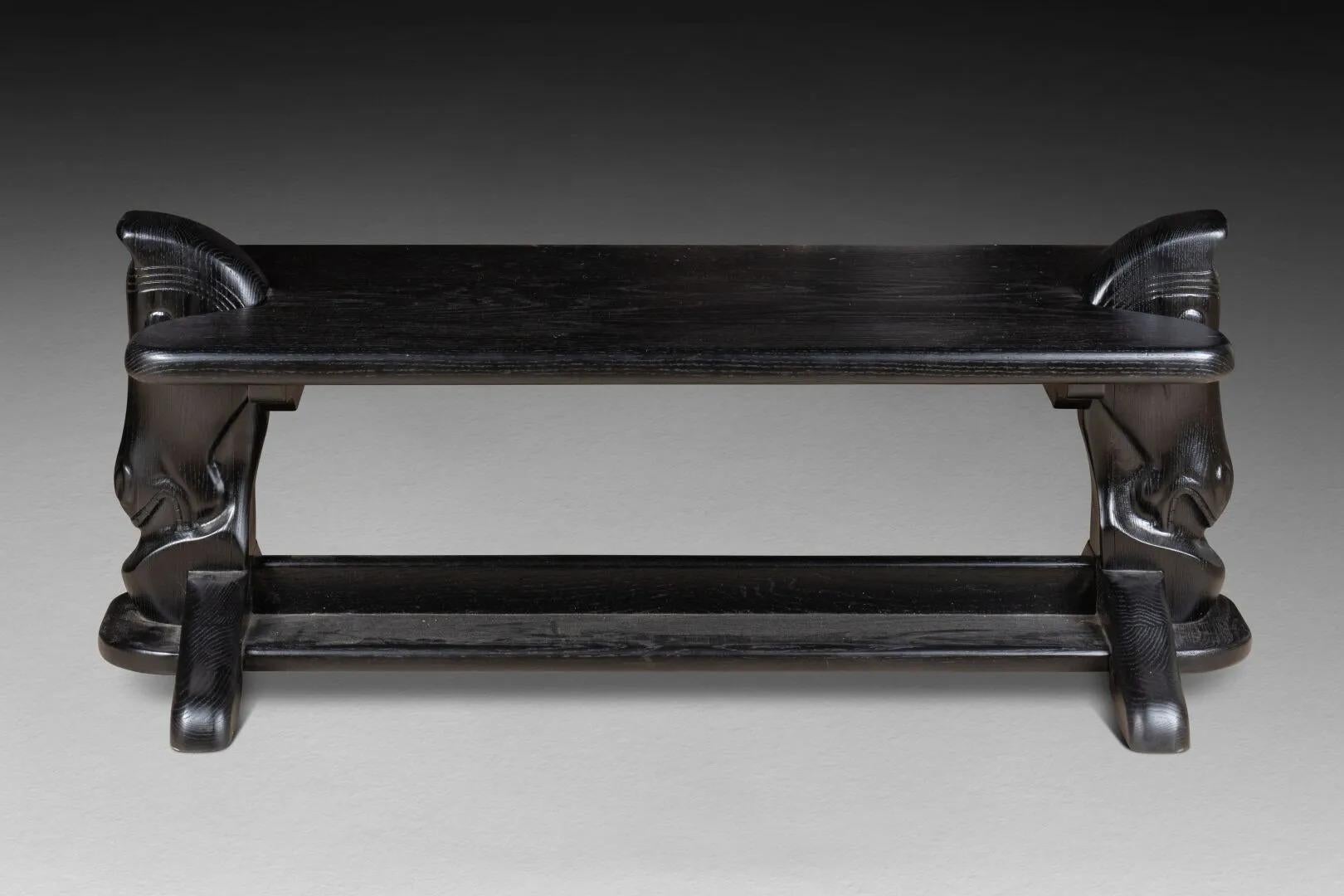 COFFEE TABLE with rectangular top. circa 1970
The feet
surmounted by horse heads and joined by a
spacer
Carved, molded and painted oak
H. 54 cm - L. 125 cm - D. 63 cm