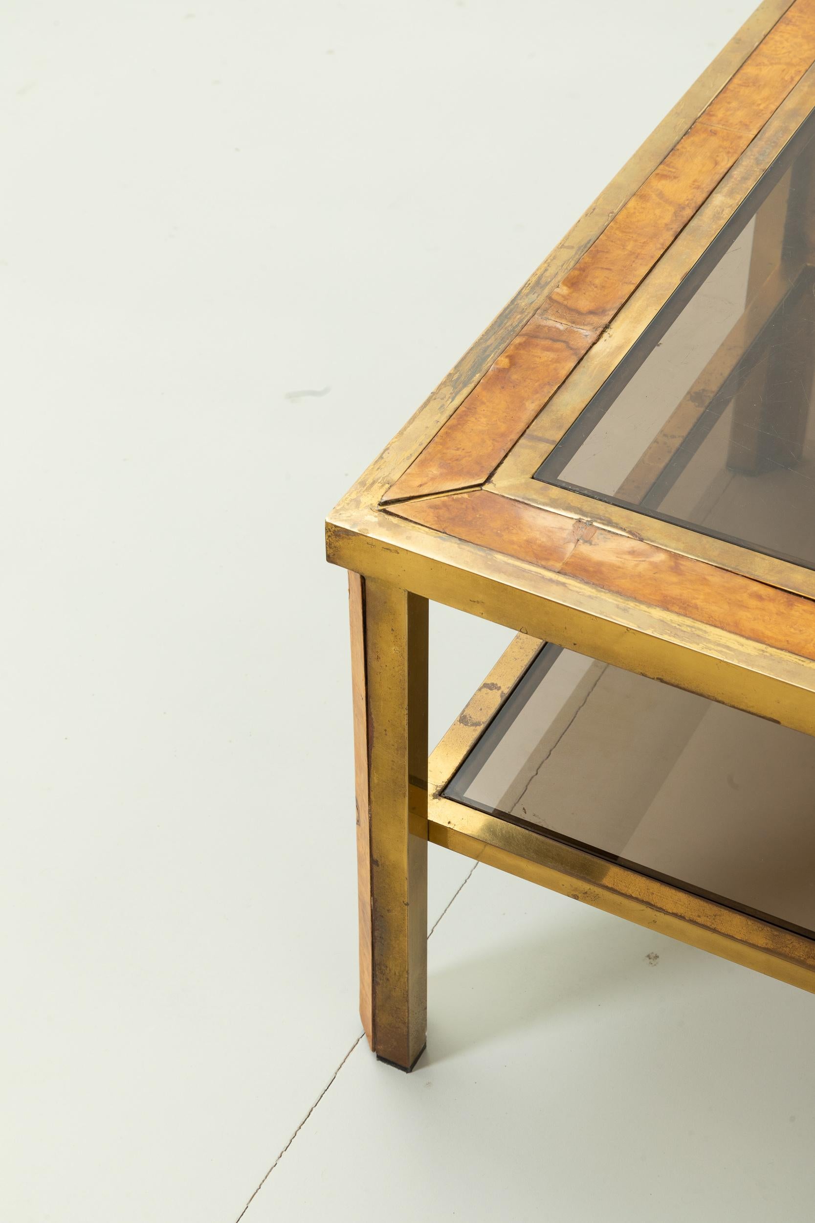 Mid-Century Modern Coffee table with two brass shelves and briarwood details, smoked glass tops. 