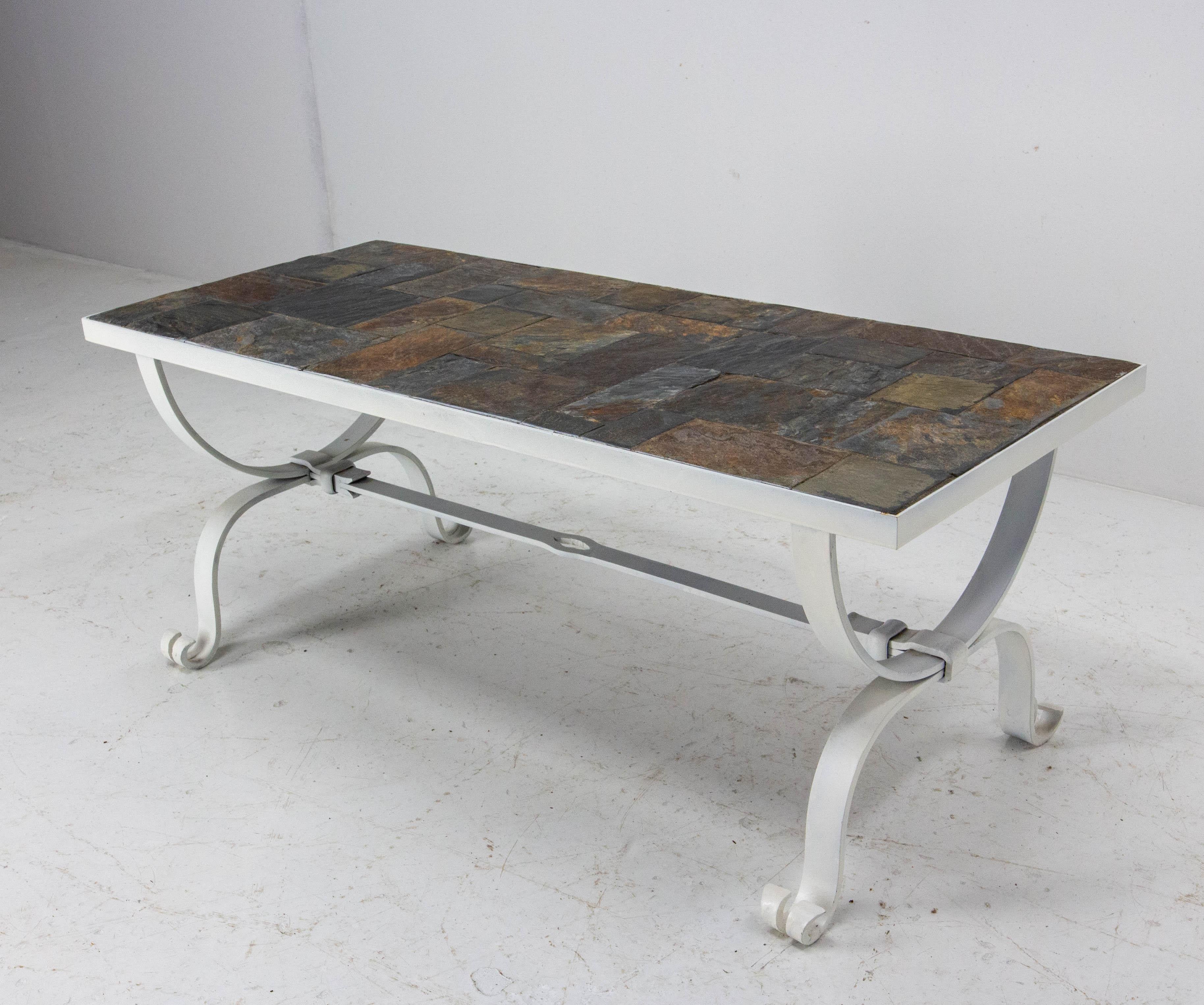 Coffee table in the style 
Fawn colored enamel tiles top between 1960s and 1970s
Metal base with superb patina 
Very heavy.

Shipping: L 100.5 P 42 H40 40 kg.
  