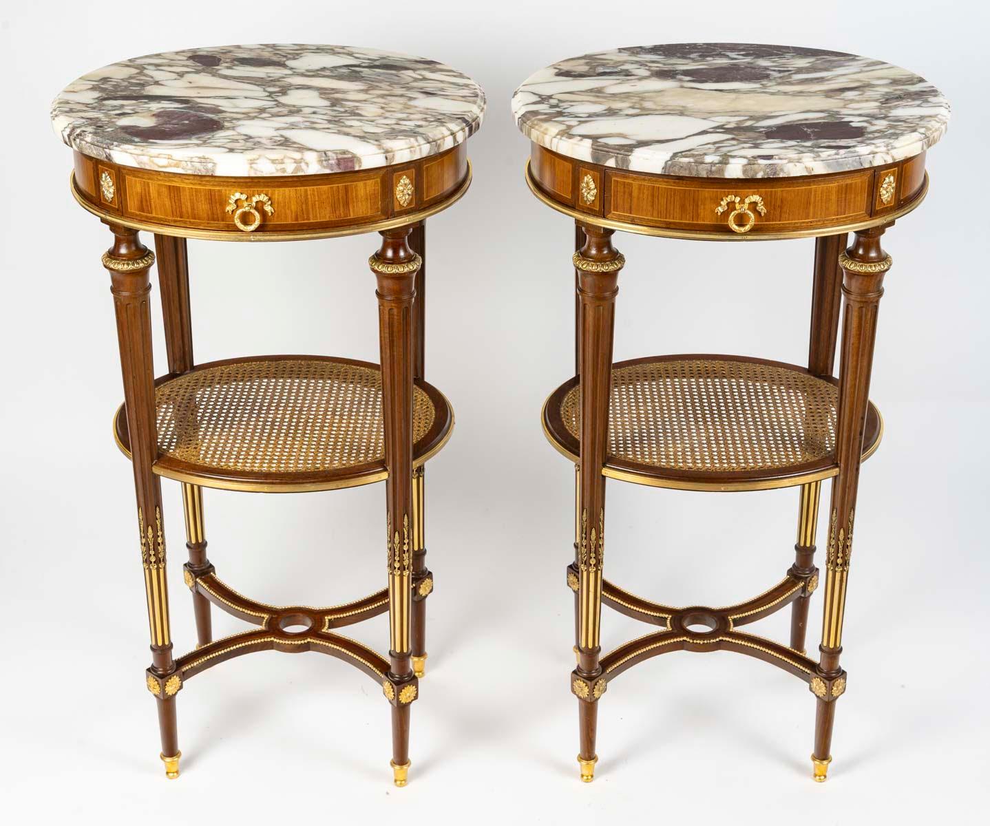Pair of Louis XVI style coffee tables, end tables or bedside tables, 19th century.

Pair of end tables, gilt bronze, marquetry, cane and marble top end tables, lounge tables or bedside tables, Louis XVI style, 19th century, Napoleon III period.
H: