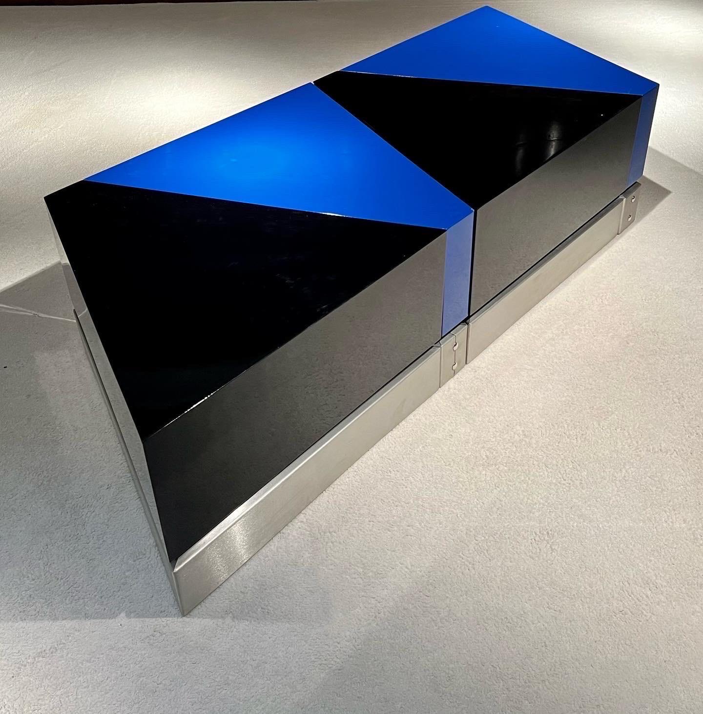 Four beautiful coffee tables created by the famous French designer Jacques Charpentier.
The tables are lacquered in black and blue with a stainless steel base.
The coffee tables can be positioned in different ways, component of coffee tables or