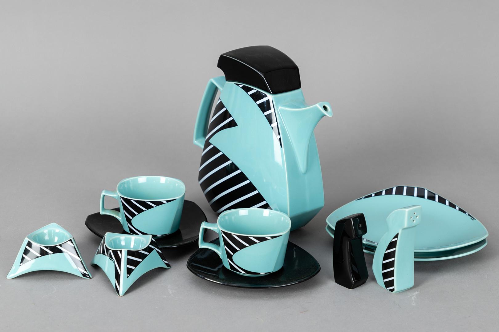 Designed by Dorothy Hafner 1985 for Rosenthal Studio-Line Germany. Porcelain, mint green and black glazed, 11 pieces,
1 x coffee pot, 
2 x coffee cup with saucers, 
2 x plates, 
2 x egg cups, 
pepper and salt shakers. 
Inscribed on the underside.