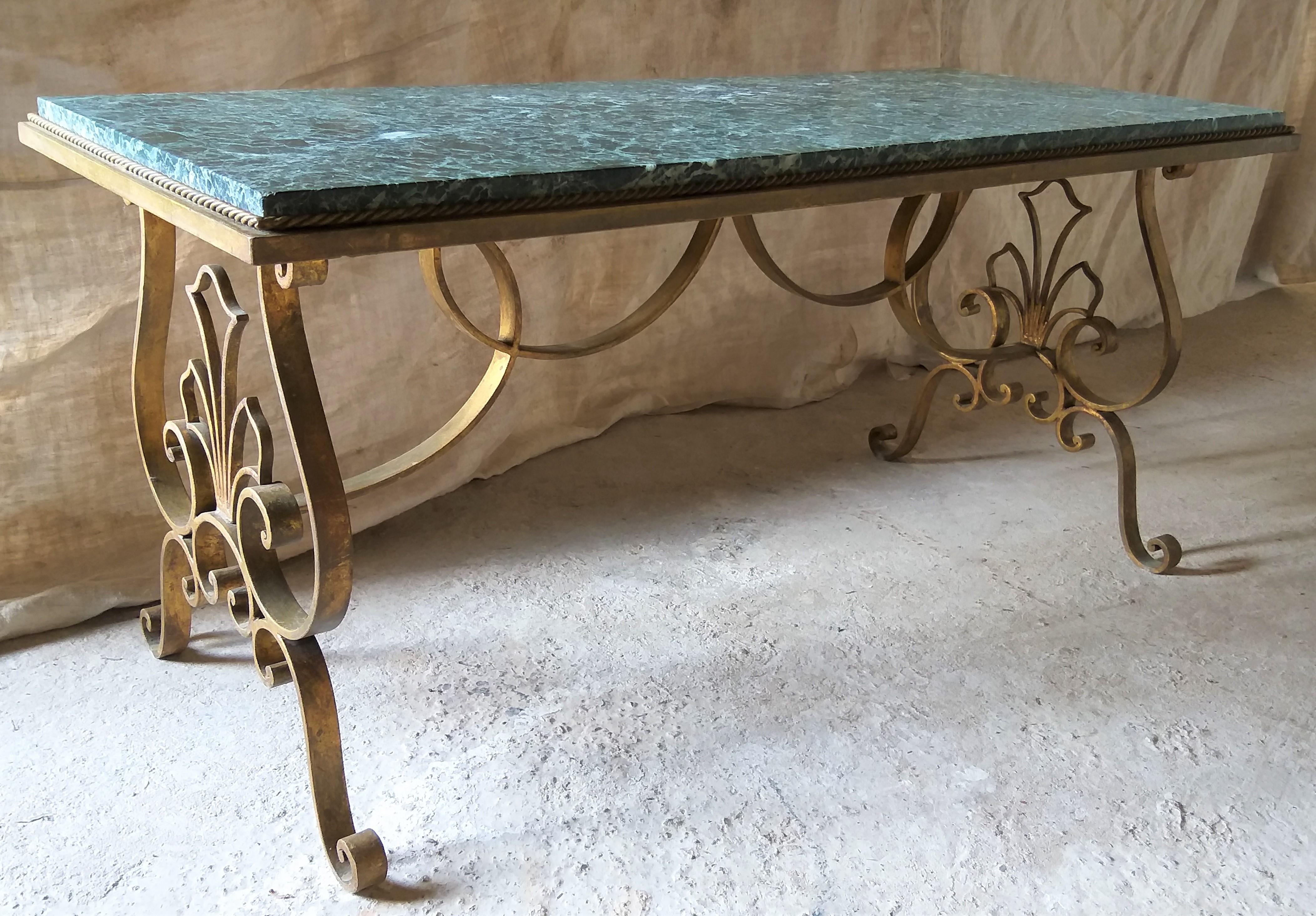Rectangular coffee/cocktail salon table with a vibrant, vivid green 'Patricia Vert' marble top. On a beautiful gilt patined iron base.
Base and top has age appropriate wear, but absolutely in very good condition. Status Aparte has one similar table