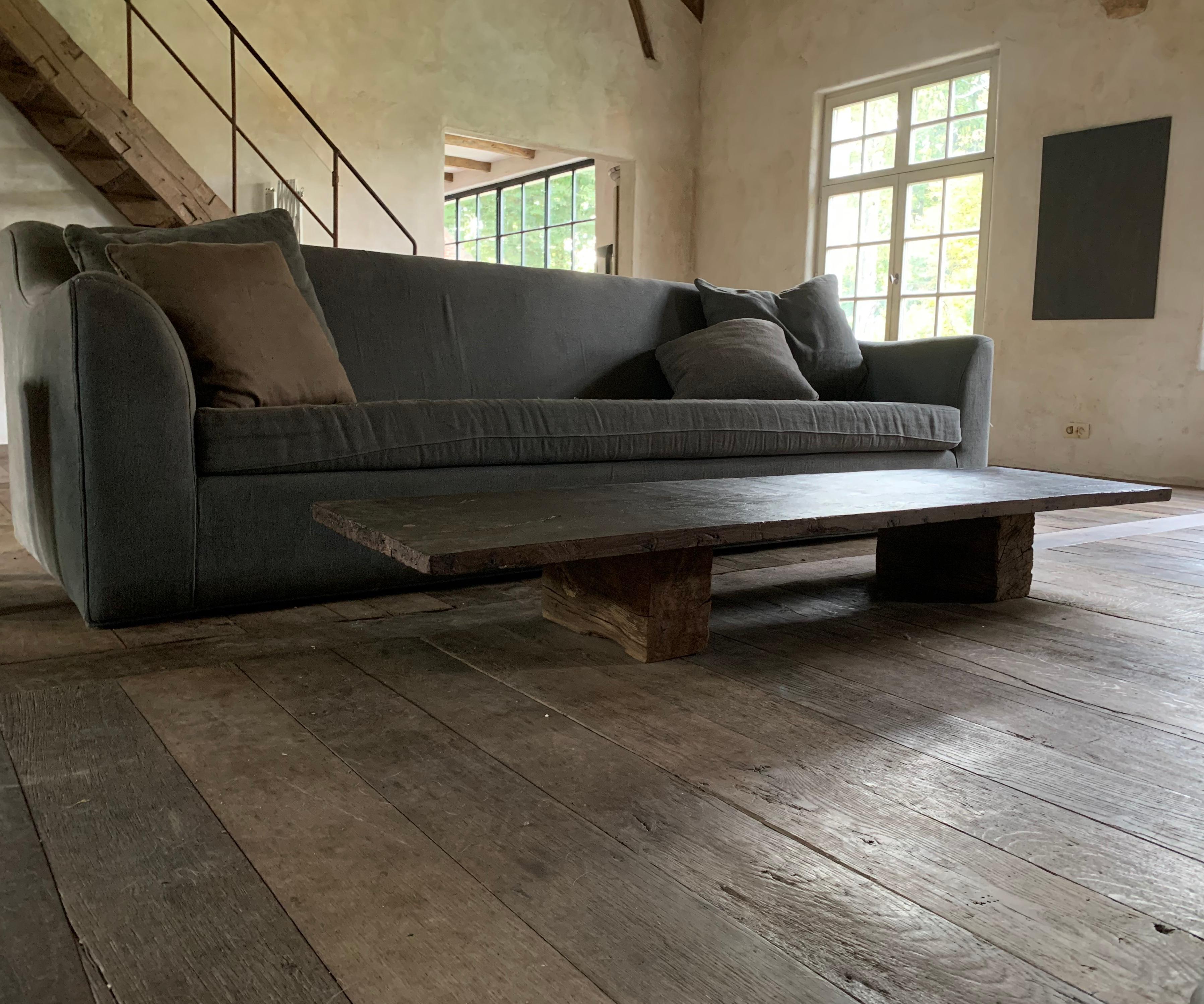 A coffeetable made by our workshop from a one slab 18th century Spanish chestnut top and the bases from reclaimed old oak beams.