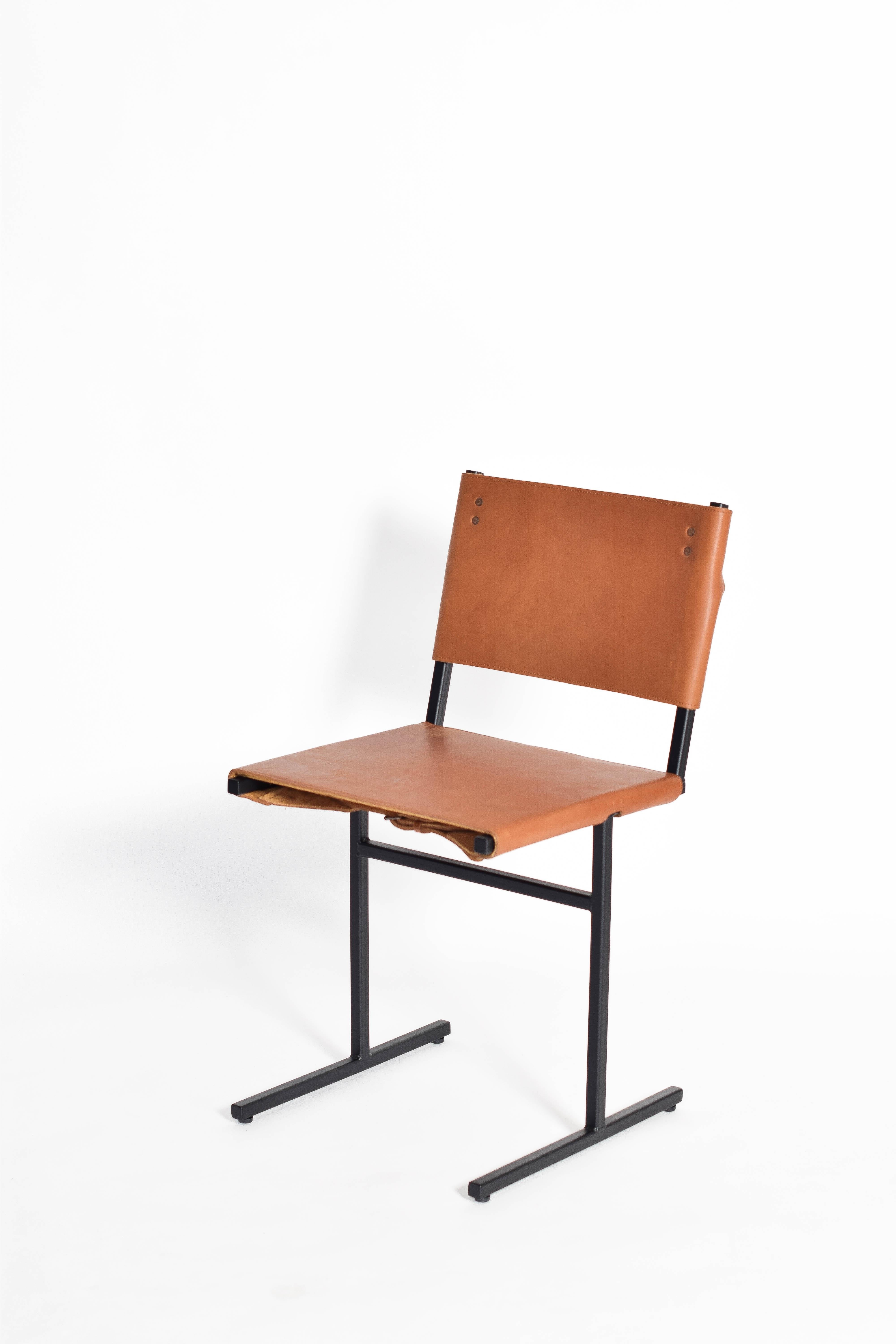 Cognac and black memento chair, Jesse Sanderson
Original signed chair by Jesse Sanderson
Materials: leather, steel
Dimensions: W 43 x D 50 x H 80 cm
Seating height 47 cm

Frame finishes available in brass, bare steel, matt black.

Five lines