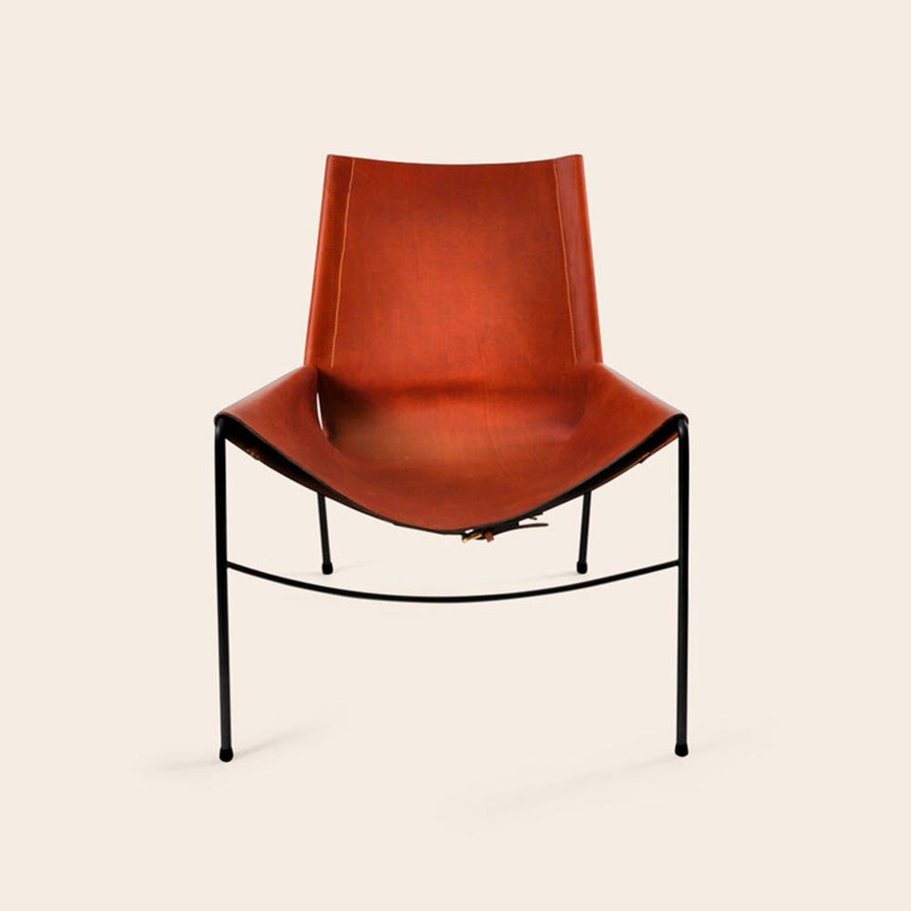 Cognac and Black November chair by OxDenmarq
Dimensions: D 71 x W 76 x H 88 cm
Materials: Leather, Stainless Steel
Also Available: Different leather colors and other frame color available.

OX DENMARQ is a Danish design brand aspiring to make