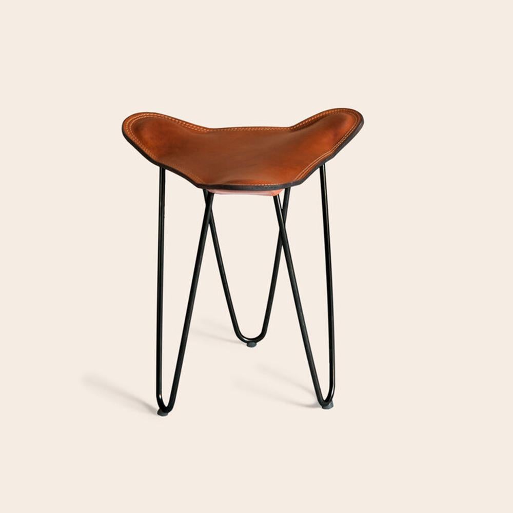 Cognac and Black Trifolium stool by OxDenmarq
Dimensions: D 40 x W 40 x H 45 cm
Materials: Leather, Steel
Also Available: Different colors and other frame color available.

OX DENMARQ is a Danish design brand aspiring to make beautiful handmade