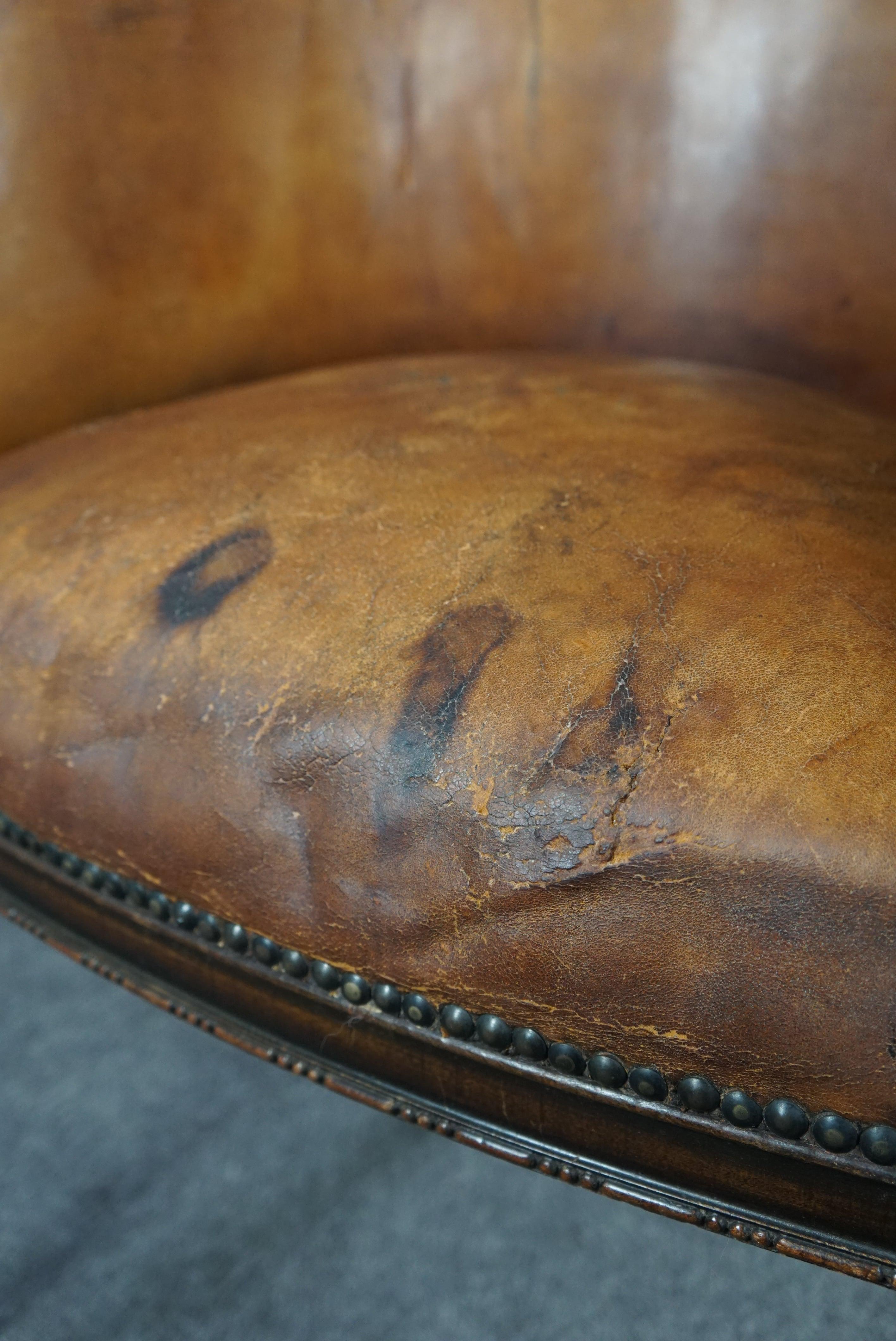 Cognac-colored antique leather tub chair with beautiful patina For Sale 5