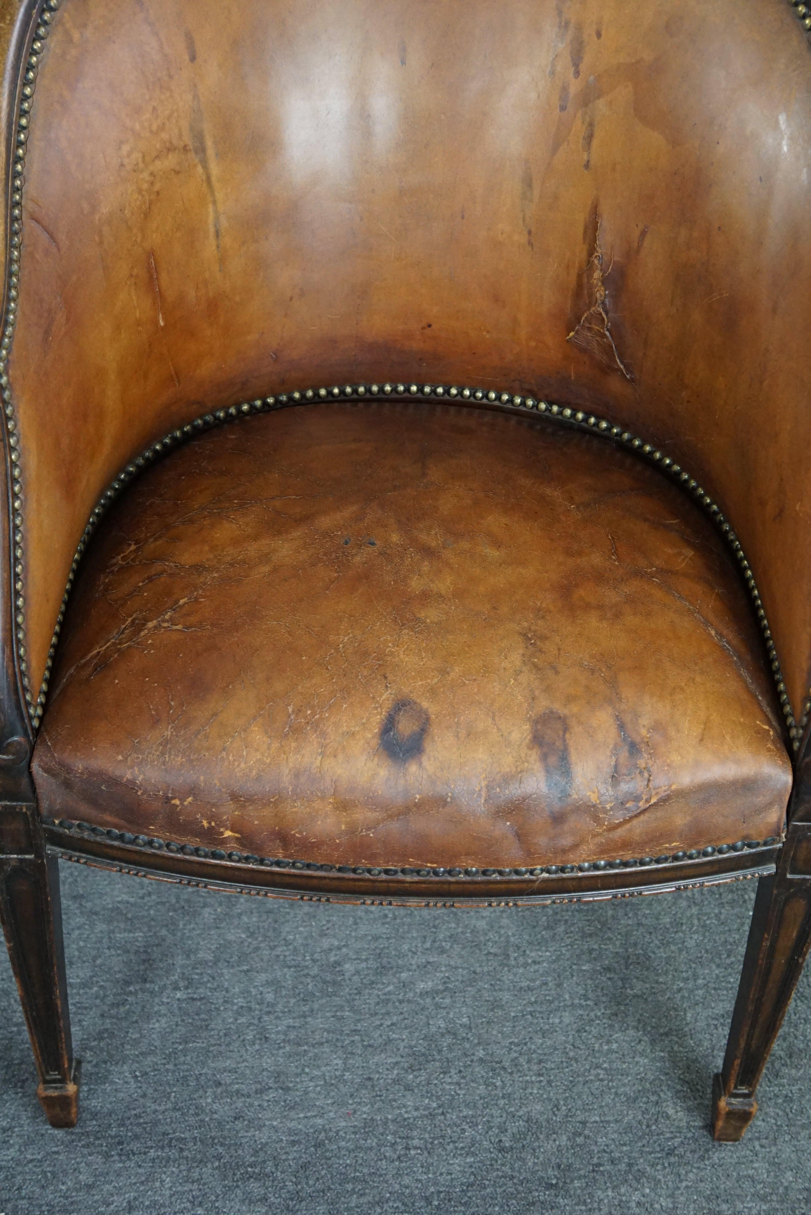 Cognac-colored antique leather tub chair with beautiful patina For Sale 2