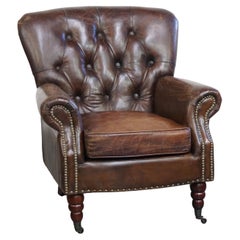 Cognac colored brown grained cowhide chesterfield armchair