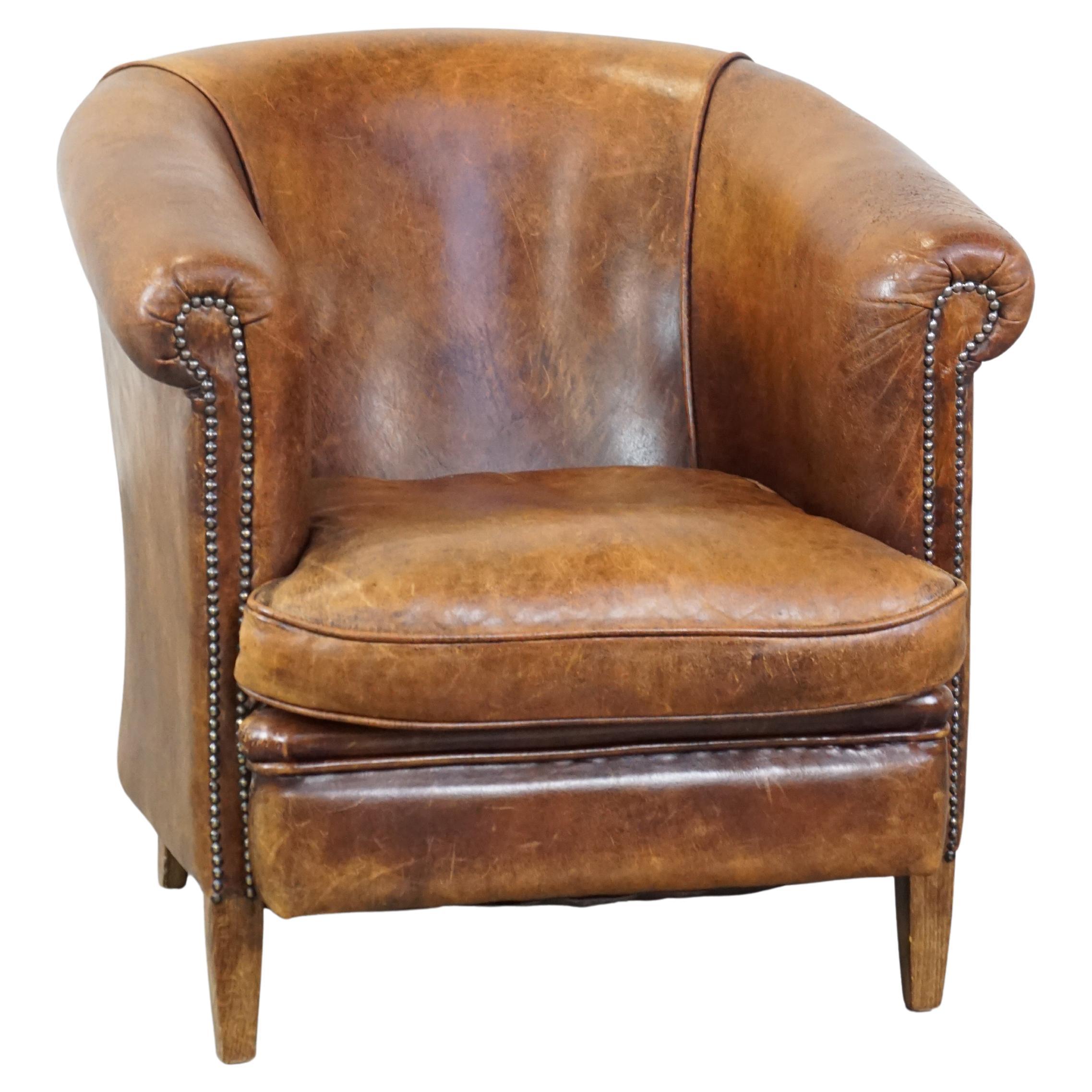 Cognac-colored, characteristic vintage sheepskin club chair