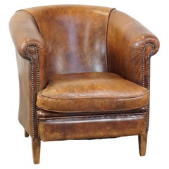 Cognac-colored, characteristic vintage sheepskin club chair
