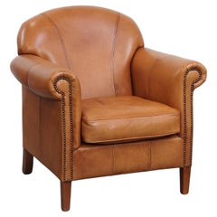 Poltrona in pelle di vacchetta color cognac