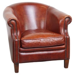 Fauteuil club en cuir de vache de couleur cognac de style anglais