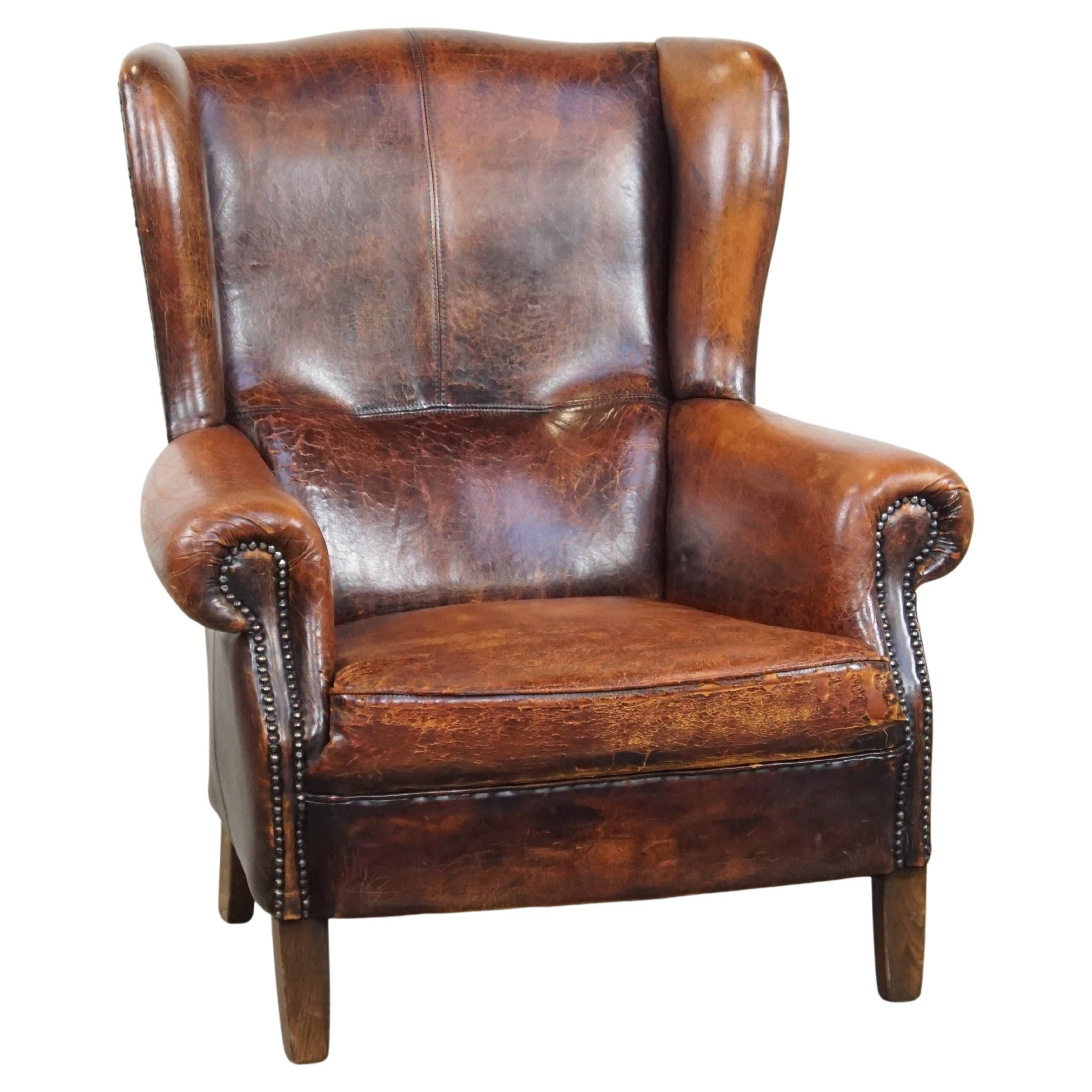 Sillón orejero vintage grande de piel de oveja de color coñac con gran comodidad de asiento