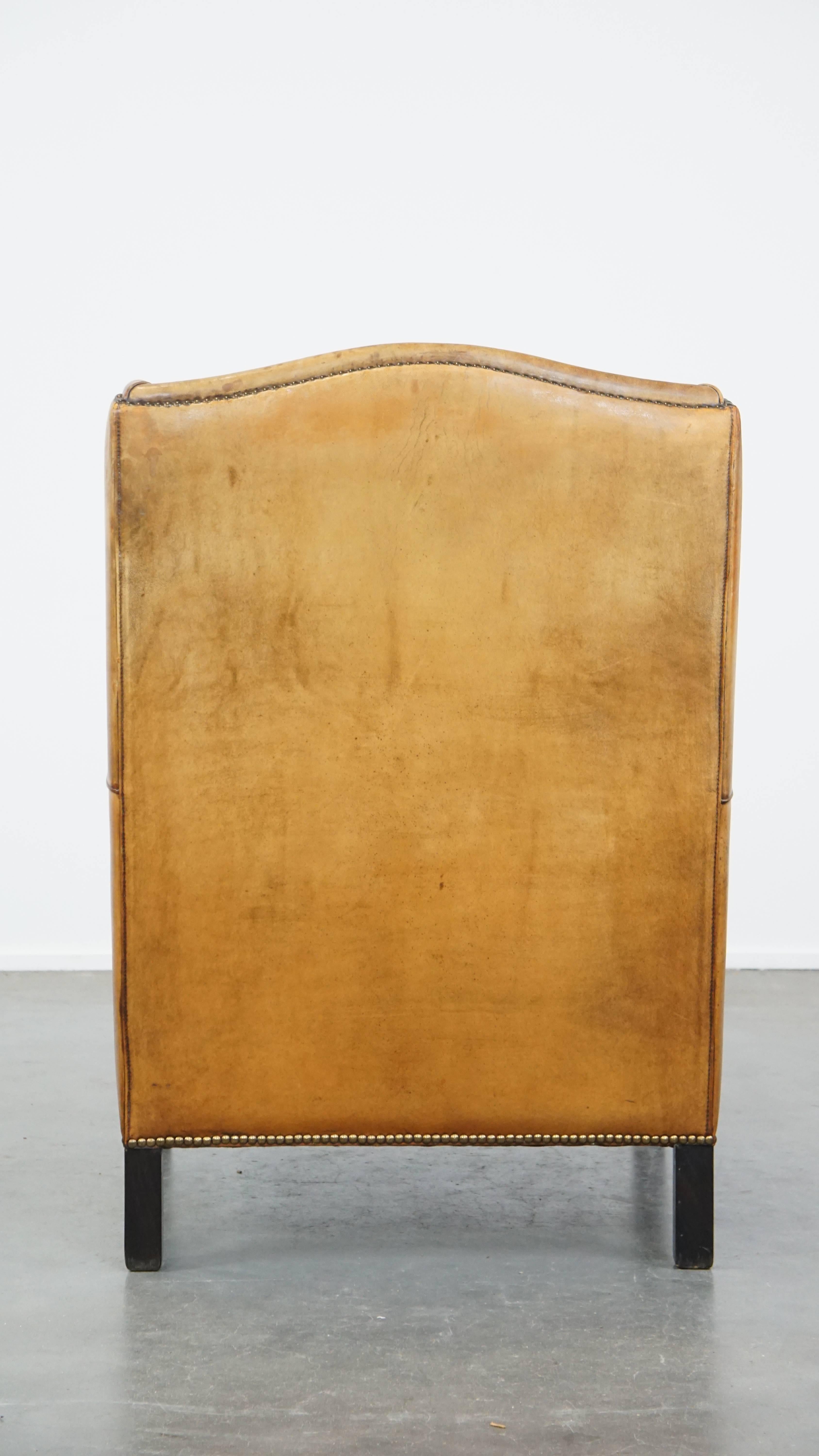 Hand-Crafted Cognac-Colored Vintage Sheepskin Leather Armchair with a High Back For Sale