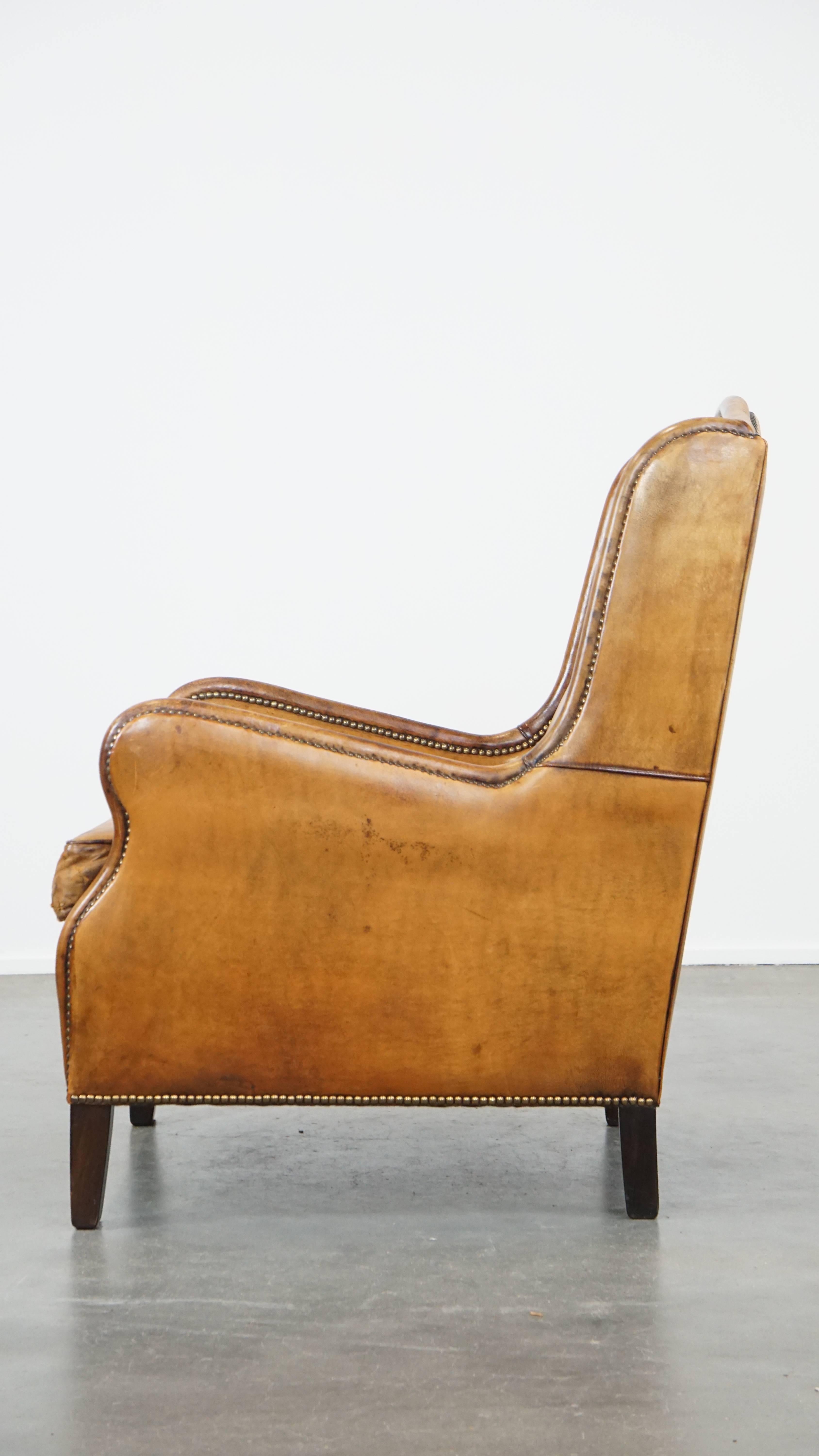 Cognac-Colored Vintage Sheepskin Leather Armchair with a High Back In Good Condition For Sale In Harderwijk, NL