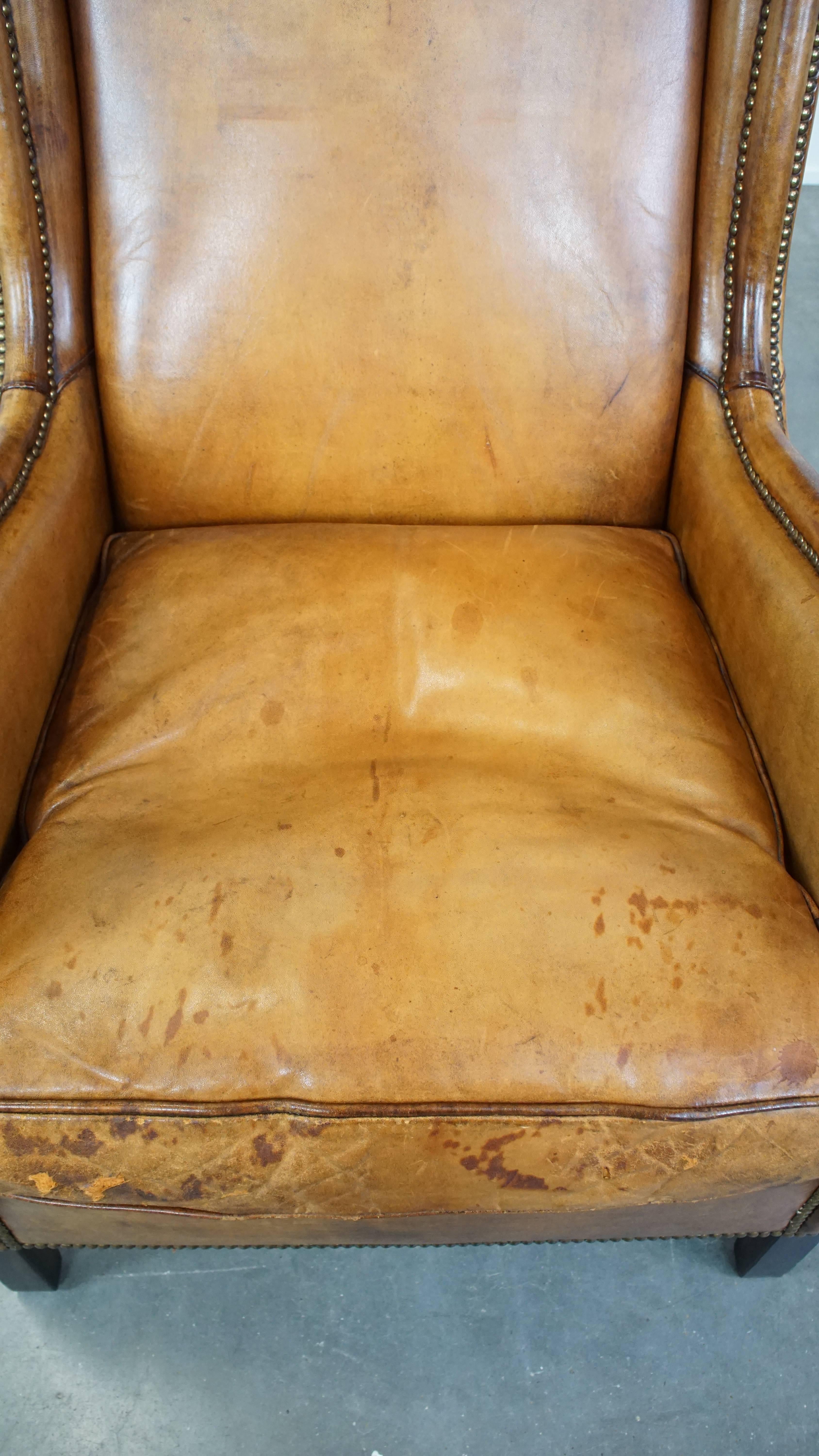 20th Century Cognac-Colored Vintage Sheepskin Leather Armchair with a High Back For Sale