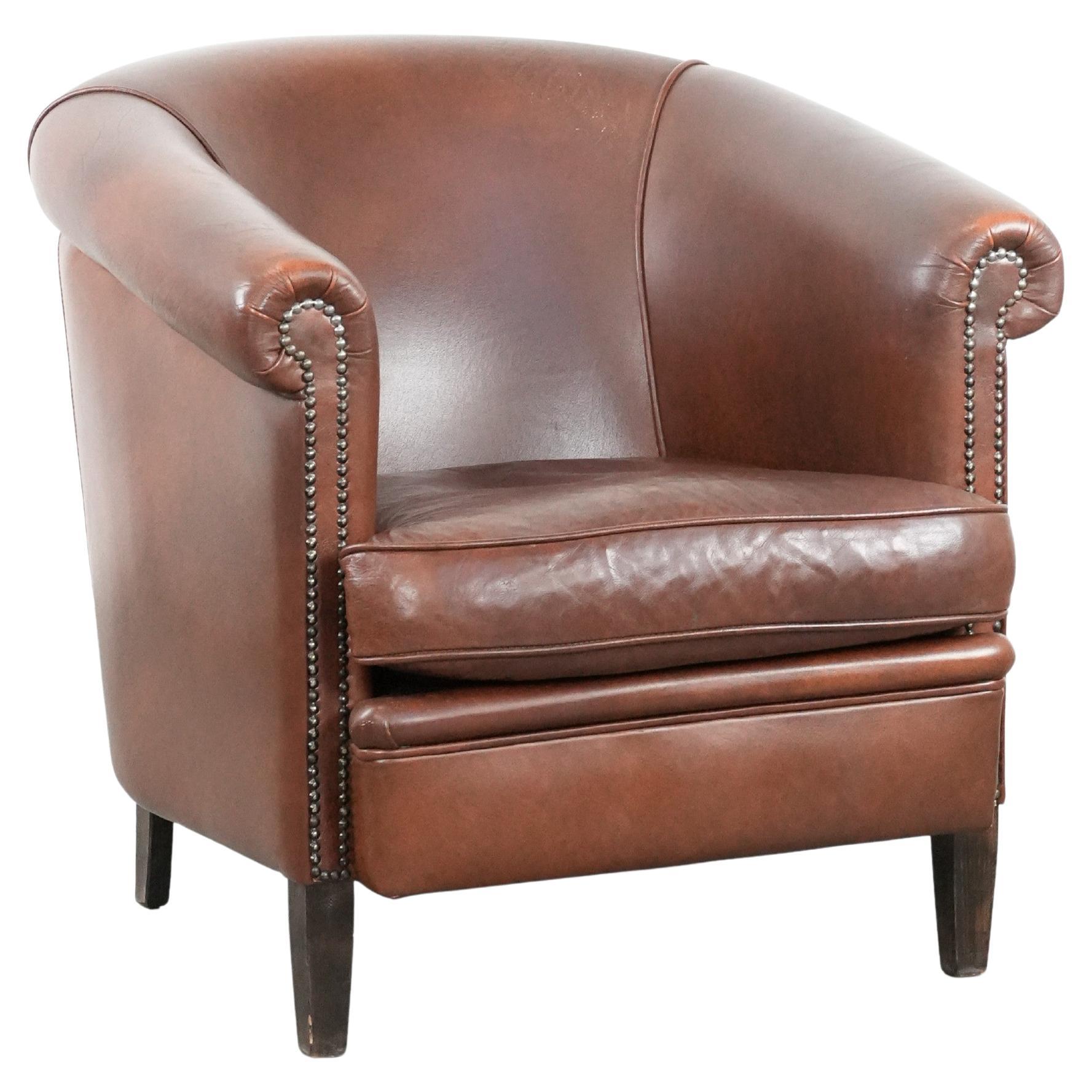 Poltrona club in pelle di mucca color cognac in stile inglese in vendita