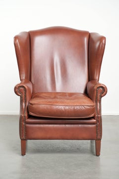 Poltrona wingback in pelle di mucca color cognac in stile inglese