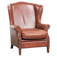 Poltrona wingback in pelle di mucca color cognac in stile inglese