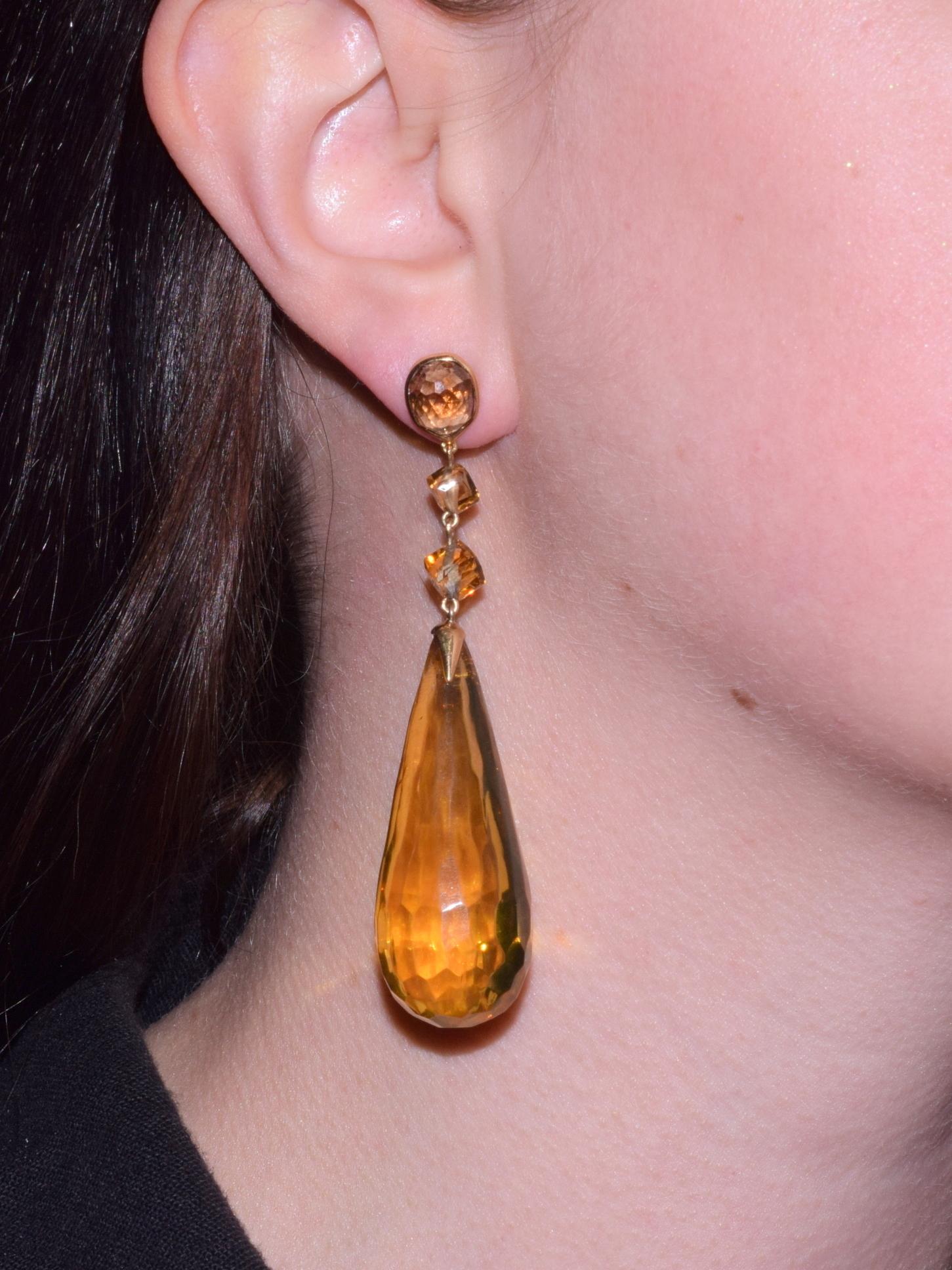 Elongated faceted amber drops suspend from a pair of cognac briolette diamonds weighing approximately 8.83 carats total with cubed citrine bead accents in an 18 karat yellow gold mounting.        
Length: 3 inches, Width: 11/16 inch.                