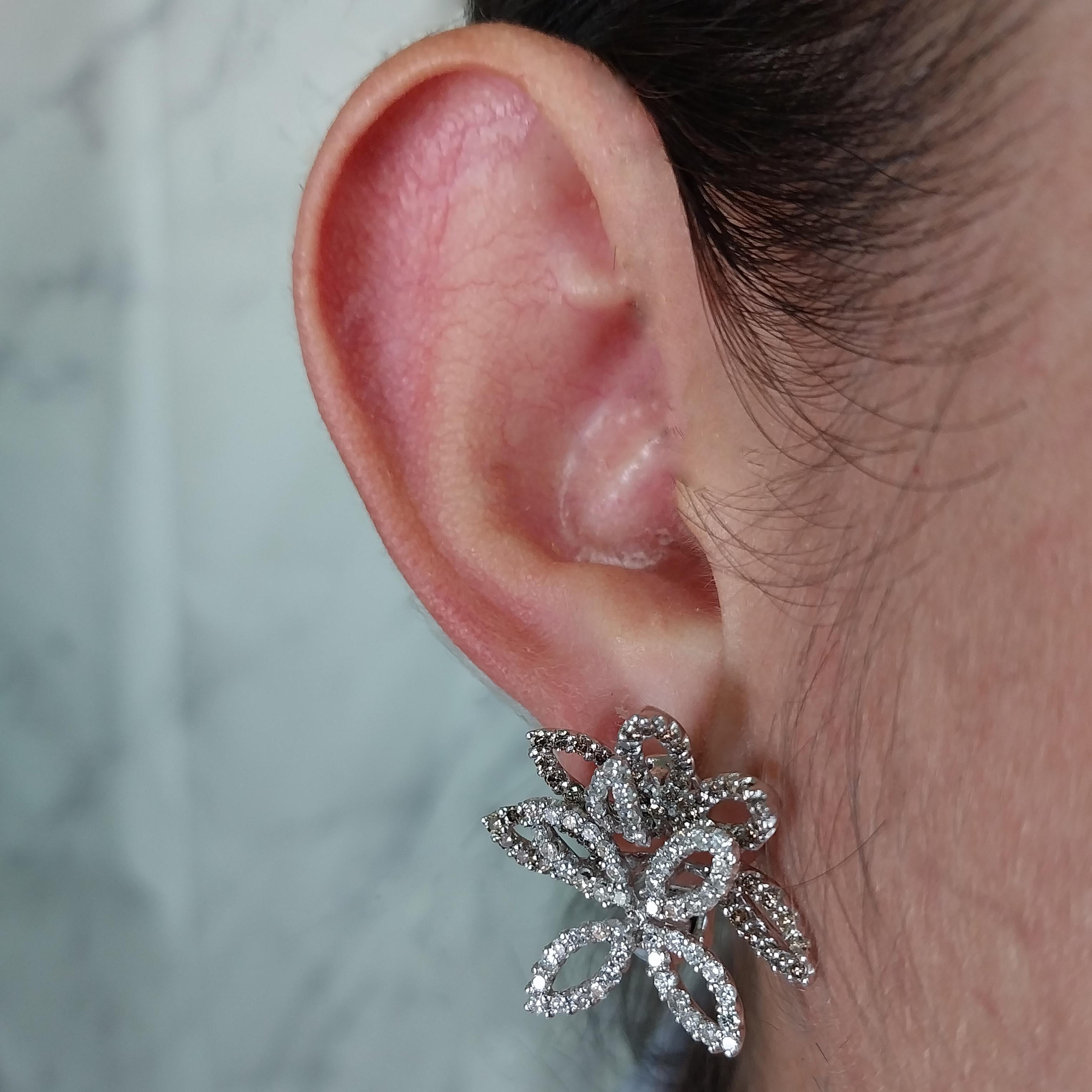 18 Karat White Gold Three Dimensional Flower Earrings Featuring 236 Round Brilliant Cut Diamonds of SI Clarity with Both H Color and Light Brown Color, Totaling Approximately 2.00 Carats. Pierced Post with Omega Clip Back. Finished Weight is 14.0