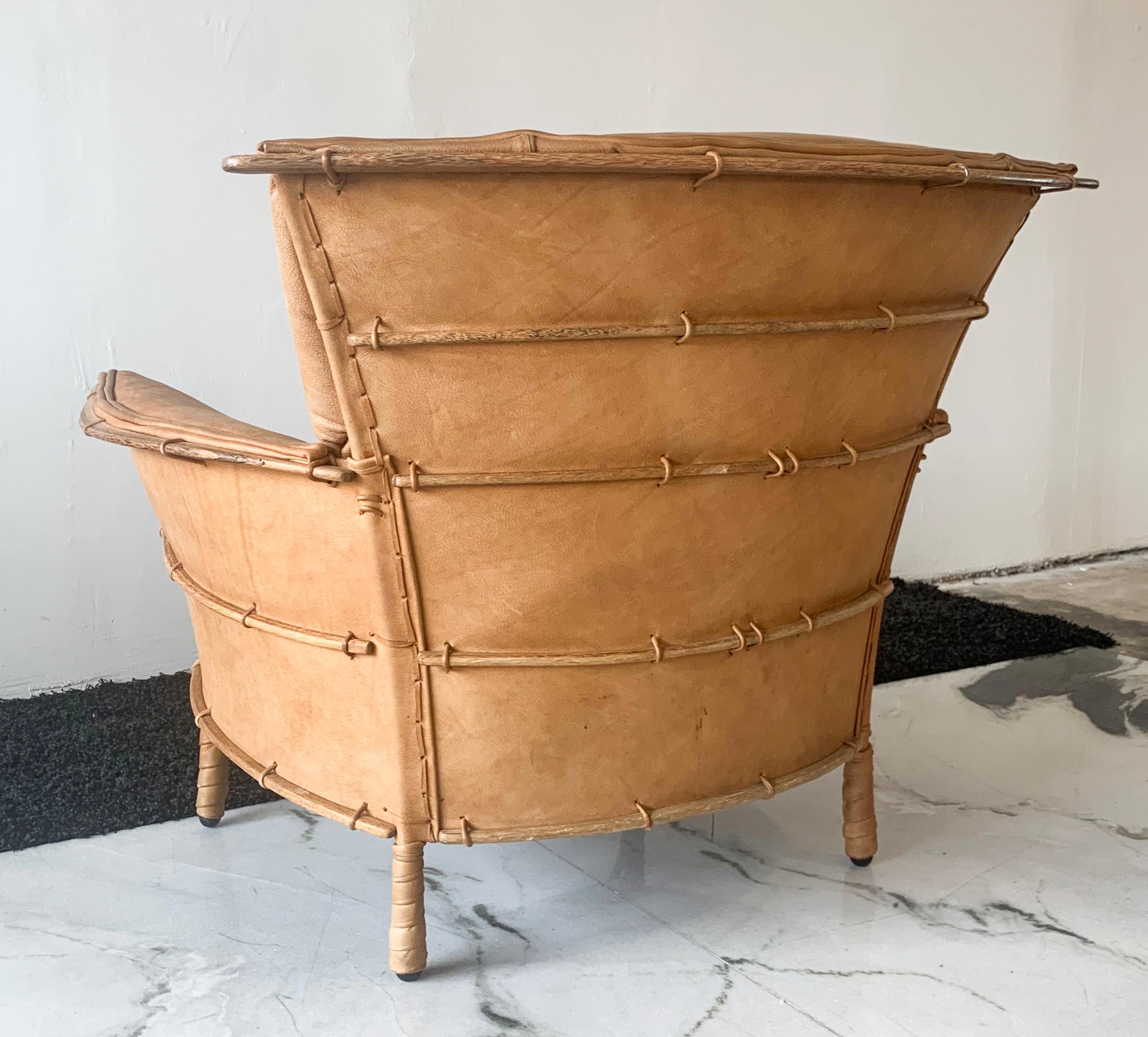 One look at this chair and it's obvious that it's special. Designed by Pacific Green Furniture, this cognac leather clad lounge features palm wood ribs / boning throughout the frame and back that echo the canoe building techniques by Indigenous and