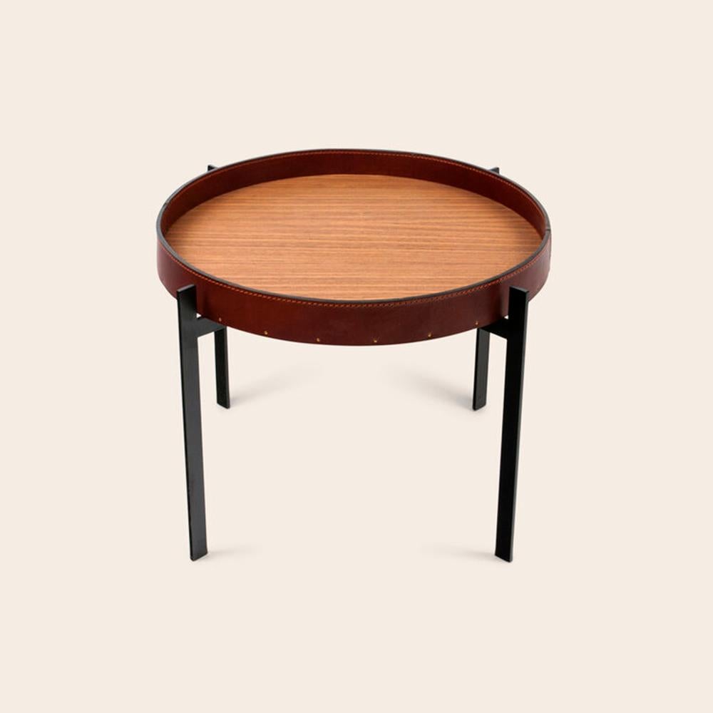 Cognac Leather and Teak Wood Single Deck Table by OxDenmarq
Dimensions: D 57 x W 57 x H 38 cm
Materials: Steel, Leather, Teak Wood
Also Available: Different top options available,

OX DENMARQ is a Danish design brand aspiring to make beautiful