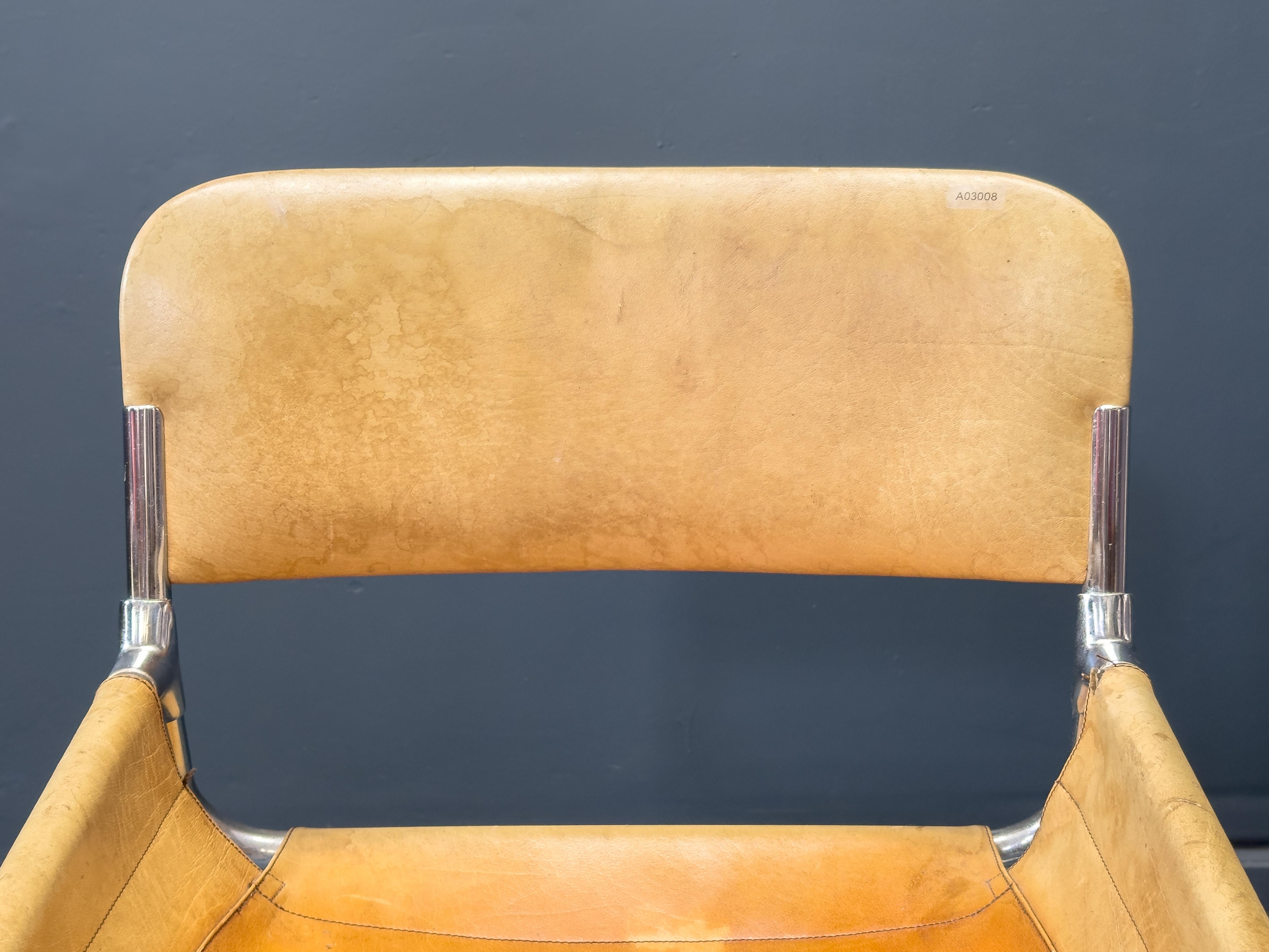 Sillón tubular de cuero coñac y cromo siglo XX en venta