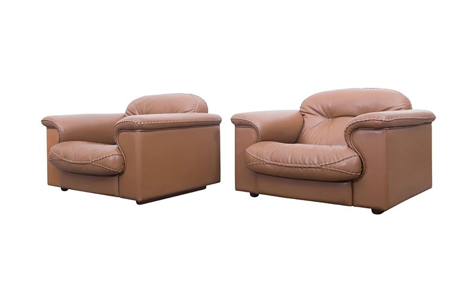 James Bond Cognac leather DS 101 Sofa set by De Sede

A three seat sofa, and a pair of lounge chairs

Adjustable and very comfortable sofas by De Sede, Swiss, 1960s
The chairs are upholstered in very high quality leather and finished with
