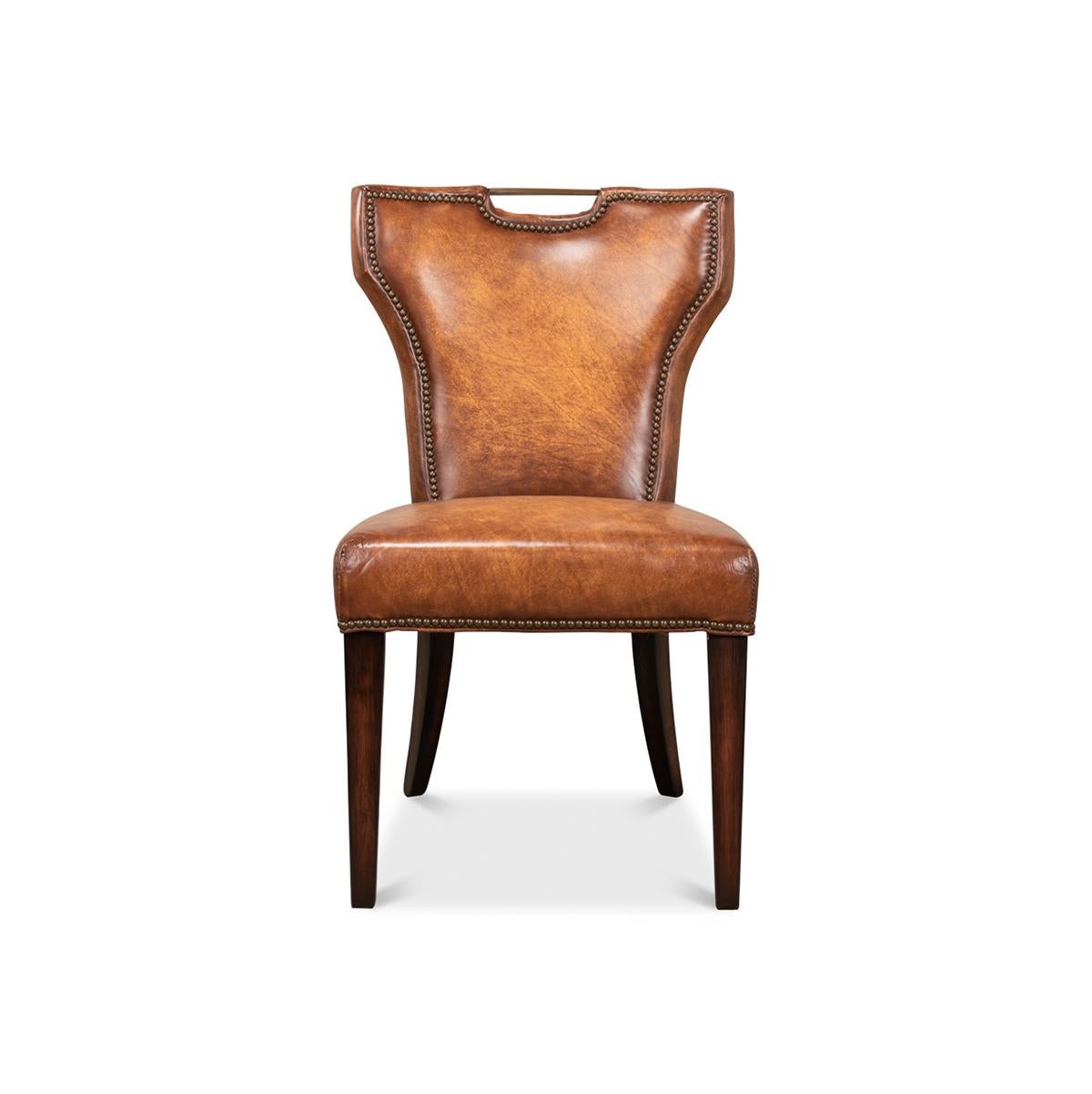 A masterpiece that brings a touch of elegance and sophistication to your dining experience. This chair is a harmonious blend of classic design and modern craftsmanship, featuring a backrest with an exquisite, cut-out handle detail, allowing for easy